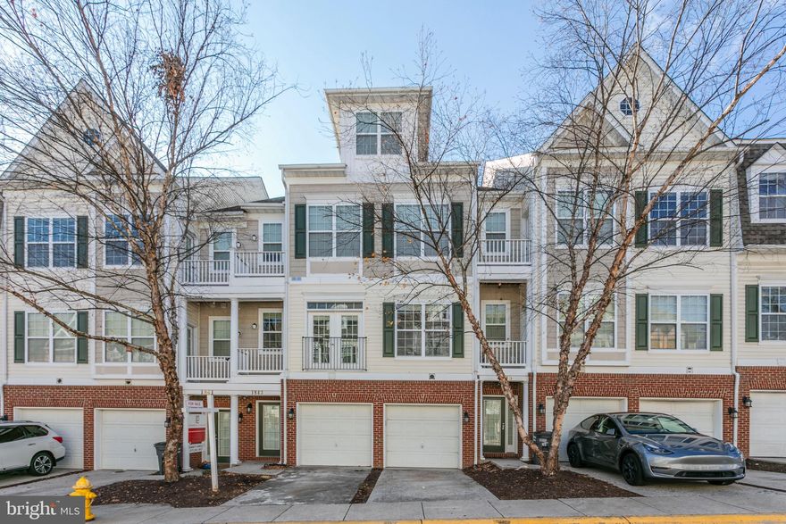 Welcome to one of the best kept homes around with fresh paint throughout and  upgrades galore! This impeccably maintained 3 bed/2.5 bath townhouse- style condo is located in the sought after Commons on William Square community and conveniently located within minutes from Prince William Parkway, I-95, VRE, Potomac Mills Shopping Mall and Stonebridge shopping center. The main level boasts a light filled open layout with upgraded hardwood floors ready for entertaining. Step into the gorgeous remodeled kitchen (2023) which includes granite countertops, white cabinetry, tile backsplash  and stainless steel appliances with a dining area that walks out to a large balcony. The impressive main level primary suite is a generously sized bedroom with two walk-in closets, private balcony access, and an ensuite bathroom complete with a soaking tub, separate shower, and double sink vanity. Downstairs is second living room with upgraded laminate flooring that connects to two additional bedrooms, an additional full bathroom, and a laundry room. The downstairs also offers access to an attached one-car garage where you can protect your vehicle and also offers extra storage.