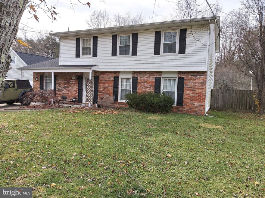 You can own a home on a large, private lot with no HOA!  4 bedroom 2.5 bath home with almost 2000 sq ft of living space.  House backs to woods for a quiet, private space for outdoor gatherings. Updated kitchen.  The carport was enclosed for workshop and is not heated.  This is a great home with room to grow.  Convenient to schools and shopping.  House sold strictly AS IS.  Tenant is in the process of packing.