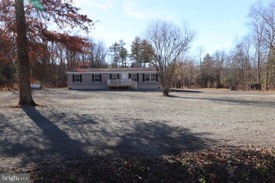 NOTHING TO DO BUT MOVE INTO THIS NEWLY RENOVATED, 3-BR, 2 BA (1,568 sq. ft.) 2008 Commodore ranch in the community of Northside Heights! From the moment you enter you'll be in love with the entry foyer, vaulted ceilings and an open floor plan, that greet you and allow you to move freely throughout the home. The spacious living room includes a wood burning fireplace that walks out to an adjoining dining room. An upgraded, bright eat-in kitchen features built-in cabinets, NEW flooring, oak cabinets, and lots of counter space. The sizeable Master BR suite features his & hers closets, jetted tub, double vanity and separate shower. NEW wall to wall carpeting throughout the living, dining rooms and all bedrooms! NEW LTV flooring in the foyer, kitchen, bath and laundry rooms! NEW Roof! NEW Water Heater! NEW Plumbing! NEW Fixtures! NEW front wood deck, perfect for relaxing and enjoying the mountain views! The lot and it's location is NEW to Northside Heights Community and offers privacy with the expanded driveway adding to it's remote and surrounding wood setting. The lot is approved for a 2 car detached garage! Located in Northside Heights Community, $515/mo. lot rent incl. water, sewer, garbage, & use of community facilities. BUYERS: Please make sure your approved for manufactured home financing . . VA, FHA, USDA or Conventional mortgages will not qualify for these homes. Call Today!