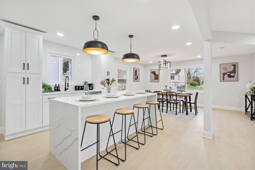 Welcome to this stunning, one of a kind, rarely available, fully renovated 6 bedroom, 3 bathroom brick Rancher. Perfectly situated on a tree lined street and desirable corner lot, you will be amazed at all it has to offer! As you step inside you will be welcomed by an open and airy floor plan, boasting over 3,000 square feet of thoughtfully designed finished living space. Natural light pours through the home’s many large windows. Other home features include a large attached 4 car garage with interior access, gorgeous 28 MIL LVP flooring throughout, an electric fireplace, entry level primary suite, luxury chefs kitchen equipped with a massive 7ft island, double pantry, quartz counter tops, and stainless steel appliances, and so much more!  The finished basement is an  absolute entertainer’s dream, outfitted with a built-in bar and an additional bedroom with a walk in closet! This home is truly unparalleled and it will not disappoint. Schedule your private tour today.