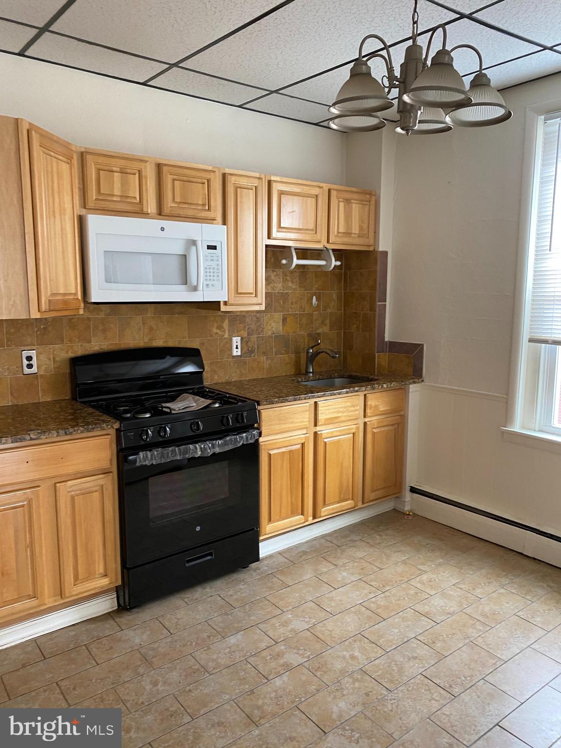 Move right into this very spacious one bedroom apartment in the heart of South Philadelphia. This apartment features wood / Tile flooring, washer dryer, granite countertops, and much more. The pink and black tiled bathroom provides old school charm. Property conveniently located close to Broad St. line and local bus routes. Make your appointment now!