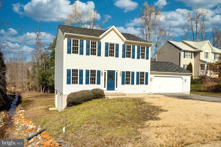 Very clean, fresh paint, new carpet, huge new deck, unfinished basement, 2 car garage, paved driveway, patio!   Easy commute to Dahlgren & Fredericksburg - best of both!