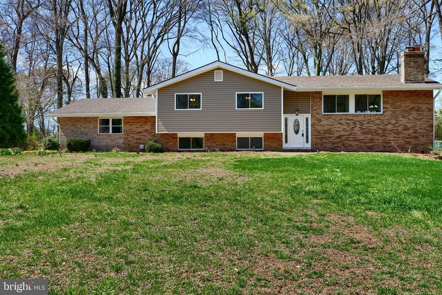 Located in the quiet community of Woodcrest this stunning Split Entry is waiting for it's new owners! Home boasts 4 large bedrooms, 3 full bathrooms and so many updates. Major updates include- New A/C Unit, New Hot Water Heater, New Windows, New Sliding Glass Door, New Siding & Gutters, New Flooring,  New Trex Deck, & Fresh Paint throughout. A new 12x24 shed has been built on property and the owner recently connected to PUBLIC SEWER, which is a rare find in Fallston! Kitchen was remodeled in 2022 with Granite Countertops and Stainless Steele appliances. The only thing you need to do is move-in!