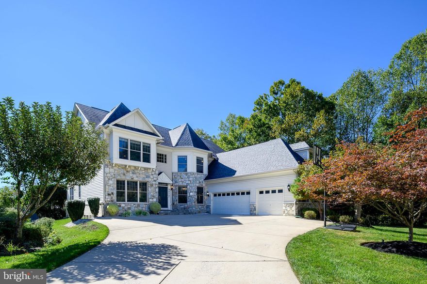 Welcome to 8859 Deep Water Lane! This breathtaking custom-built home is perfectly situated on a premium (water-view) lot in Howard County’s sought-after gated community of Stone Lake. From the moment you approach the property, it’s clear that this is no ordinary home. With unobstructed, panoramic views of Stone Lake, this residence offers an idyllic lifestyle with access to nature, luxury, and privacy, all within a secure, serene setting. The Stone Lake community is truly a retreat offering 24-hour security and a wealth of amenities catering to an active, outdoor lifestyle. Residents enjoy exclusive access to a beautiful 25-acre lake with a beach, boat house, and private boat slips. Fishing enthusiasts will love the stocked lake. There’s also a pavilion available to rent for private events, as well as walking and jogging paths, tennis and pickleball courts, baseball fields, practice putting green and playground. The HOA also takes care of grass-cutting and snow removal. The home is designed for both elegance and comfort, with 6,000+ finished square feet, six bedrooms, five and a half baths and three car garage. As you enter the home, you’ll be greeted by expansive lake views from nearly every room, with large windows that invite natural light and bring the outdoors in. The spacious family room features coffered ceilings, cozy fireplace and breathtaking views of the water beyond. Just off the family room is a large morning room, an ideal spot to start your day with a cup of coffee while soaking in the serene lakefront landscape. The chef’s kitchen features a large island, granite countertops, wall oven, gas cooktop with range hood, tile back splash and walk-in pantry. For more formal occasions, the elegant dining room sets the perfect stage for memorable meals. The main level also boasts a private library with custom shelves/cabinets, as well as a separate office, ideal for working from home. Upstairs, the primary suite is a true sanctuary, complete with a cozy sitting room with its own fireplace, a luxurious en-suite with soaking tub, walk-in dual head shower, dual vanities, and a large walk-in closet. The second bedroom has its own en-suite bath, while two additional bedrooms share the hall bathroom. The versatile fourth level loft is ideal for guests as it is complete with its own full bath. An upper-level laundry room adds convenience. The finished basement is an entertainer’s dream, complete with a full bar that includes a sink, refrigerator and wine fridge. The expansive recreation room features a fireplace, built-in speakers, and offers the perfect atmosphere for movie nights or game days. The sixth bedroom can function as an exercise room or an extra bedroom and is accompanied by a full bath for convenience. There’s also a large storage space for seasonal items. The home boasts a $17,000 indoor music system on the main and lower level as well as the exterior, complete with pre-wired touchscreen room controls, allowing you to enjoy music wherever you see fit. The dual-zone HVAC system, installed in 2022, ensures year-round comfort. Additional features include gutter guards, a security system with motion detectors and pet identifiers, and tech-ready pre-wired outlets in key rooms. Stepping outside, you’ll find a remarkable outdoor living space overlooking Stone Lake. The owners spent $150,000 building the two-level stone patio, which spans over 1500 square feet and features a fire pit, outdoor kitchen with a Twin Eagle grill and skillet, refrigerator, TV, and built-in speakers—perfect for entertaining or relaxing. This home blends luxury, comfort, and functionality, offering everything you need to enjoy life at its fullest. Located in a premier community with top-tier amenities and steps away from the beauty of Stone Lake, it’s truly a one-of-a-kind property. Don’t miss your chance to own this wonderful home!