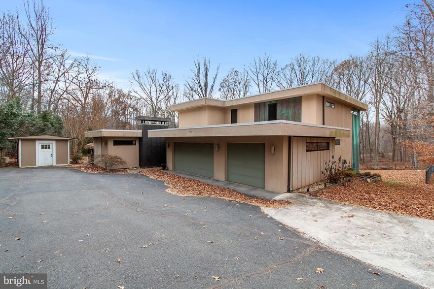 Fantastic find in Fairfax Station! This 4BD/4.5BA contemporary home features gorgeous, sweeping views from every corner. Upon entering, the well laid-out floor plan flows from the large living area with convenient access to the kitchen. The kitchen is complete with a large island and stainless steel appliances. Upstairs, the expansive primary bedroom includes an ensuite bathroom and large walk-in closet.  There are three additional sizable bedrooms (two bedrooms share a hall bathroom and one bedroom has an en-suite bathroom). The lower-level walk-out basement is made for entertainment featuring a large rec room and a full bath. Enjoy the outdoor space with a Tiki Bar and fire pit area on almost 5 acres. 3 car garage. Easy access to commuter routes.