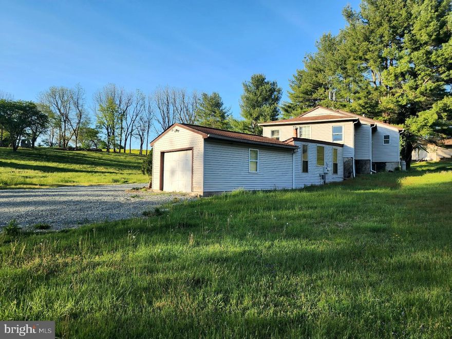 This is a beautiful 2.7 acre lot that backs up to rolling, Lancaster County  farmland.  The peaceful, rural setting is hard to beat.  Their is a garage/barn for tractors or toys or storage.  There is a 3 BR home that needs lots of work.   Fix up the home for an affordable way to have a home with lots of outdoor space in a bucolic setting.  Or start over and build your dream home from scratch.   Lots of possibilities but land like this for sale in Lancaster County is rare.  Square footage includes the garage that has been finished into living space and is approximate and not guaranteed.
