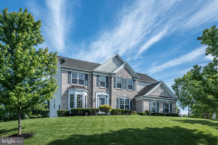 Beautifully updated corner lot brick front 5BRs, 4.5BAs home w/ side load garage! Main lvl office, 2 story FR w/ gas FP, KIT w/ granite & dble wall oven. Elegant molding t-out. New floors! Hardwood on 3 levels! MBR w/ tray ceiling & massive WIC. Spacious BRs w/ attached BAs. Walkout lvl basement w/ 5th BR, full BA, rec rm & 2 unfin rms w/ great potential! Huge yard w/ deck & Landscaping! Must see!