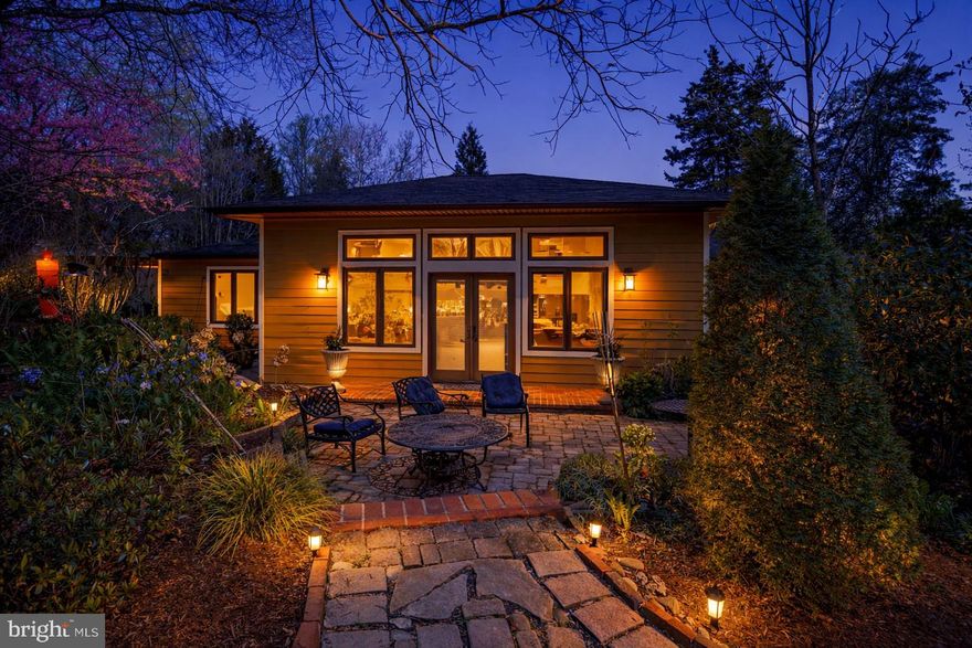 Magical adorable cottage style single story  home in Epping Forest, remodeled in 2007, 2010 & 2022 in ready to move in condition. This is one of the largest flat lots in community consisting of 9 lots! Property has been well kept with heated floors, 2 fireplaces and a great room with French doors opening to a patio surrounded by  a 1/2 acre lot that has been designed by a Master Gardener with many beautiful Magnolias, Sycamore, European Chestnut and Norway Spruce trees. It's a 10 level "ZEN" garden with a separate vegetable garden. The garden area has an outdoor fireplace and an outdoor cedar shower. The house is spacious with tons of storage and parking. Property has winter water views of Severn River. Epping Forest is a gated waterfront community on the Severn River, just down from the Naval Academy. The community has a clubhouse/bar serving food, beer & wine, a community Chapel, a brand new marina, tennis & pickleball courts, basketball courts, kayak storage, swim team, lifeguards for swimming beach, and a social calendar which includes 4th of July fireworks, labor day events, oyster roast, bull roast, and volleyball tournaments. Epping Forest is a Special Tax District (per tax bill) with binding Rules & Regulations.