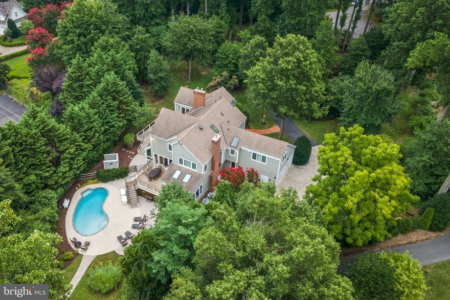 Elevated  waterfront with deep water,  heated salt water pool and extremely well maintained custom built Post and Beam home sits on a private 1.65 acres  site  minutes from the heart of Annapolis!  The private deepwater pier features 3  slips (8-9 feet mlw), one with a 16,000 lb lift and  recent rip-wrap on protected Crab Creek. Three finished levels will accommodate a large numbers of guests or in laws with  5 Bedrooms , 4.5 Baths and approximately 5800 square feet, 3 brick FPs, wood floors, open floor plan, Ipe decks,1st floor primary suite & tranquil water views. Privacy, specimen trees and lush landscaping. Roof, hardiplank exterior and windows all replaced in 2012. Whole house generator.  Gracious home is perfect for  entertaining! Ideally located minutes from downtown Annapolis, and quick access to BWI, DC and Baltimore. Welcome home to Hollygate!