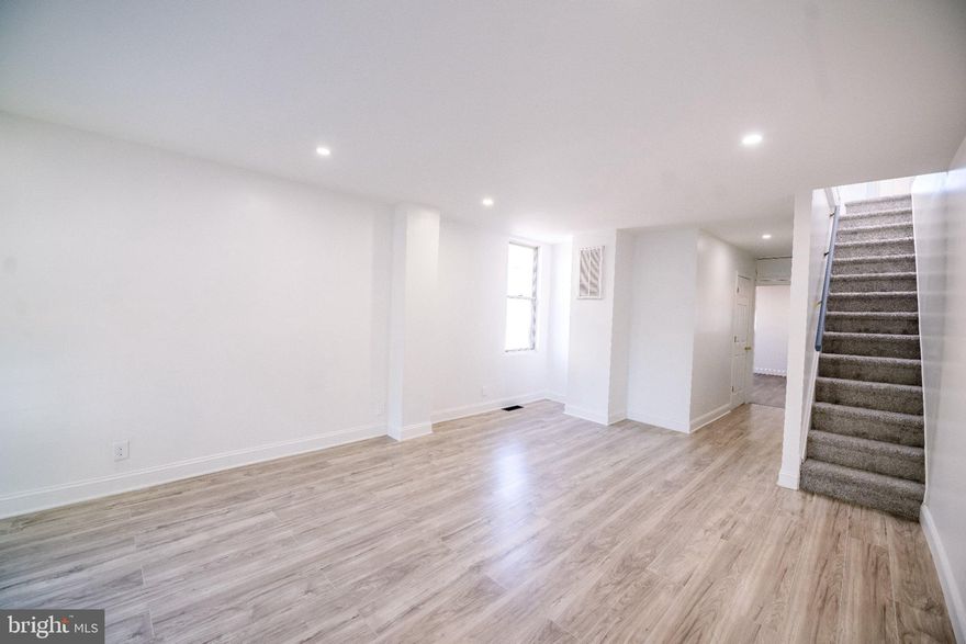 Rare Find! Updated 4 Bedroom/ 2 Bathroom End-of-Row Townhome with Incredible House-Hacking or Investment Potential. Whether you are a first-time homebuyer looking for a spacious home (or a smart way to offset your mortgage) or a savvy investor seeking a high-yield, low-maintenance property, this home is designed to maximize your ROI from day one. This home also comes equipped with a 2nd full kitchen in the basement! The fully finished lower level can act as its own self-contained living space, complete with a full kitchen, living area, full bath, and bedroom setup. The classic Baltimore skylight and upstairs windows bring in an enormous amount of natural light. This versatile do not stay on the market for long. Don't miss your chance to own a property that works for your future. Contact us today to schedule a private showing before it's gone!
