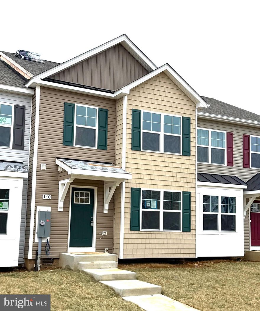 Brand New Townhomes in The Communities of Burwell! Everything you want, already built in.
Nearly complete for quick delivery, these 2-level townhomes offer 1,440 sq. ft. of thoughtfully designed living space featuring 3 bedrooms and 2.5 baths.  The open main level welcomes you with luxury vinyl plank flooring, a spacious family room with bump-out, and a beautiful kitchen complete with granite countertops, a large island, separate breakfast bar, pantry, and stainless steel appliances—perfect for everyday living or entertaining.  Upstairs, the primary suite impresses with a vaulted ceiling, walk-in closet, and spa-inspired bath featuring a tile shower with glass door and double vanity. Two additional bedrooms and a full hall bath provide plenty of space for family, guests, or a home office.  Enjoy outdoor living on your 10x12 rear deck, plus the convenience of ample overflow parking just steps away.  The builder is also offering closing cost assistance!