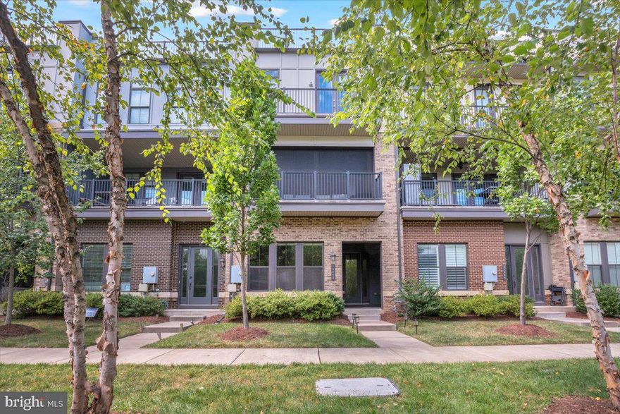 Welcome to 23088 Lavallette Sq, Brambleton, VA!

This stunning Tea Garden model by Van Metre (built in 2018) offers nearly 3,000 sq. ft. of luxury living across four levels, highlighted by a private rooftop terrace—perfect for relaxing or entertaining.

The entry level features a spacious recreation room and powder room, ideal for a home gym, media space, or playroom. Upstairs, the heart of the home boasts a gourmet eat-in kitchen with custom cabinetry, an oversized island, and premium stainless-steel appliances. The adjoining Great Room flows seamlessly onto a private covered veranda, perfect for enjoying morning coffee or spring breezes. A convenient office/study and an additional powder room complete this level.

Throughout the home, you’ll find gleaming hardwood floors and privacy blinds on every window. The primary suite is a true retreat, offering a private balcony, customized walk-in closet with built-ins, and a spa-like ensuite with dual vanities. Two spacious secondary bedrooms, a large full bath, and a generous laundry room are all located on the bedroom level.

The rooftop terrace is a standout feature, offering unobstructed views and flexible outdoor living space. The home also includes a rear-entry 2-car garage with driveway parking for 2 more vehicles (4 total).

Located in highly sought-after Brambleton, you’ll enjoy exceptional community amenities—multiple swimming pools, walking and biking trails, tennis and basketball courts, parks, playgrounds, a community center, and included high-speed internet & cable TV. Just minutes to the Greenway, Dulles Airport, Ashburn Metro, shopping, dining, and entertainment, this home truly combines luxury, convenience, and lifestyle.

Don’t miss the chance to make this exceptional property your new home!