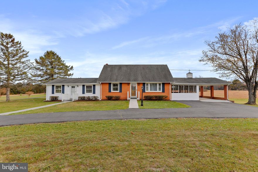Rare Opportunity: Charming 4 Bedroom/3.5 Bath Home on Expansive 5+ Acre With "BEAUTIFUL VIEWS ALL AROUND". Exceptional acreage that is conveniently situated along a state-maintained road mere minutes from I-66. With no HOA or restrictive covenants, this unique gem offers limitless possibilities. Boasting a versatile layout, this home presents an ideal scenario for diverse living arrangements. Whether it's the option to rent out one side while enjoying comfortable living in the other, housing extended family members seeking their own space, or maximizing rental potential for both units, this property provides flexibility. Meticulously maintained and thoughtfully updated, this home seamlessly blends modern enhancements with timeless charm. Some of the recent upgrades on the left side include a new roof (2024), new HVAC system (2023), new flooring (2023), new main level bathroom) (2023), new fresh paint (2023), new kitchen countertop & sink/faucet (2023), new light fixtures on main level and an updated panel box (2023). The brick home on the right side basement area has received a facelift with updated bathroom (2023), new flooring (2023), and a fresh coat of paint. The  full bathroom underwent a tasteful renovation approximately 5 years ago, ensuring a blend of functionality and elegance and original hardwood floors that are in excellent condition. Featuring separate electric meters, well pump replaced (2022), a paved half-circle driveway, and a covered carport on the right side, this property offers convenience and practicality. Step outside and unwind on the expansive screened porch, offering a serene retreat and picturesque views and warm inviting spaces ideal for both sitting and dining. Buyers to verify if this property has the potential for a family subdivision.  Close proximity to the George Washington National Forest, Skyline Drive, Shenandoah River, and nearby golf courses are perfect for the outdoor lovers. Explore this property firsthand to truly grasp the exceptional lifestyle it offers and the full extent of its beauty and potential." 
Has one tax Id. Per tax record -  Land Use: 2 Single-family Residential (suburban) (.01 - 19.99 Acres)