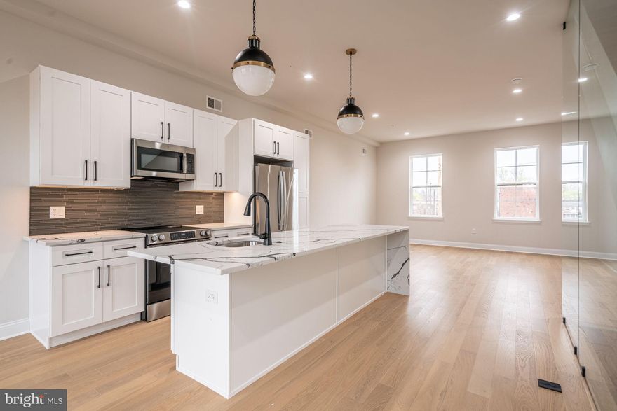 HOMEBUYER LOAN PROGRAM OFFERING 100% Financing, $5,000 LENDER CREDIT AND NO PMI.

Welcome to the epitome of urban living with a blend of modern luxury and financial savvy - 2721 Lorraine Court at Wynnefield Heights Square.   Fully approved 10-year tax abatement promises affordability, ensuring an attractive investment in your future. Spanning three generously appointed floors, this home boasts three exquisite bedrooms and three full bathrooms, catering to your need for space and privacy. The first floor introduces a seamless blend of utility and style, featuring a convenient bedroom and bathroom suite alongside a mechanical closet, further leading to a 1-car garage adorned with recessed lighting, a remote-operated overhead door, and a durable concrete floor - a rare find in city living. Ascend to the second floor where your culinary dreams come alive in a kitchen designed to impress. Manufactured quartz countertops complement an expansive island, setting the stage for memorable gatherings. GE stainless steel appliances, under-cabinet lighting, and 42" high wall cabinets elevate your cooking experience, while the engineered white oak flooring adds warmth and sophistication throughout. This level also hosts separate living and dining areas, with a balcony off the dining room inviting natural light and offering a glimpse of the neighborhood's vibrance. The third floor is a sanctuary of comfort, housing the master bedroom complete with essential amenities like dual closets and a master bathroom ·featuring a double vanity, frameless glass enclosure, and tiled finishes that evoke serenity. The additional bedroom mirrors this thoughtful design, ensuring comfort for all residents. Topping off this residence is a roof deck, a private retreat overlooking the cityscape, promising serene mornings and lively evenings under the Philadelphia sky. With every detail thoughtfully curated to enhance your lifestyle, 2721 Lorraine Ct isn't just a home; it's the cornerstone of your new chapter in Wynnefield Heights Square.  Fall 2026 Delivery