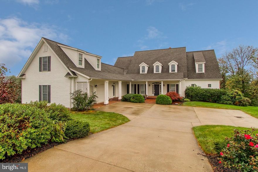 Custom designed 5,200 sq ft home on 1.6 Acres boasts of Southern Charm.  Featuring a 1st floor Master suite with Den / Office Area, Large walk in closet, Luxurious Mstr Bath.  17' Vaulted and Tray Ceilings, Hardwood floors, Incredible Kitchen with Jennair Stainless Appliances, large island, and built-ins. Transom windows, Crown and chair moldings, Columns,  unlimited millwork through out the home. Formal LR with fireplace and access to the deck overlooking the back yard.  Full walk out basement with bath rough in, thimble for future wood stove, garage door access , as well as french door access to the lower patio.  Bonus Room over the garage, 1st floor living at it's best.  This home is a must see to appreciate!!!