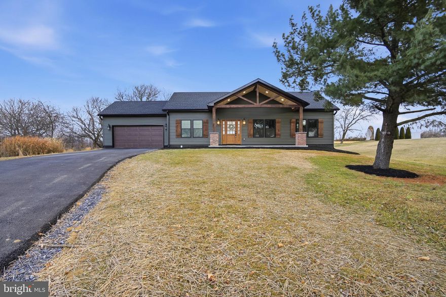 Welcome home to this beautifully designed new construction, single-level residence that blends modern finishes with warm, natural charm. Featuring 3  bedrooms and 2 full bathrooms, this thoughtfully crafted home offers effortless living all on one level, with the added bonus of attic storage. The heart of the home features a striking 14.5-foot ceiling over the open-concept living and kitchen space, creating a bright and airy atmosphere filled with natural light. The open-concept living and kitchen space is perfect for both everyday living and entertaining, offering generous cabinetry, a pantry for added storage, and a convenient laundry area located just off the kitchen. The spacious primary suite is a true retreat, complete with a walk-in closet and a private ensuite bathroom. Enjoy mornings or evenings on the welcoming front porch, adding charm and curb appeal to this inviting new home. Designed with comfort, style, and flexibility in mind, this property is ready for its new owner to make it their own.