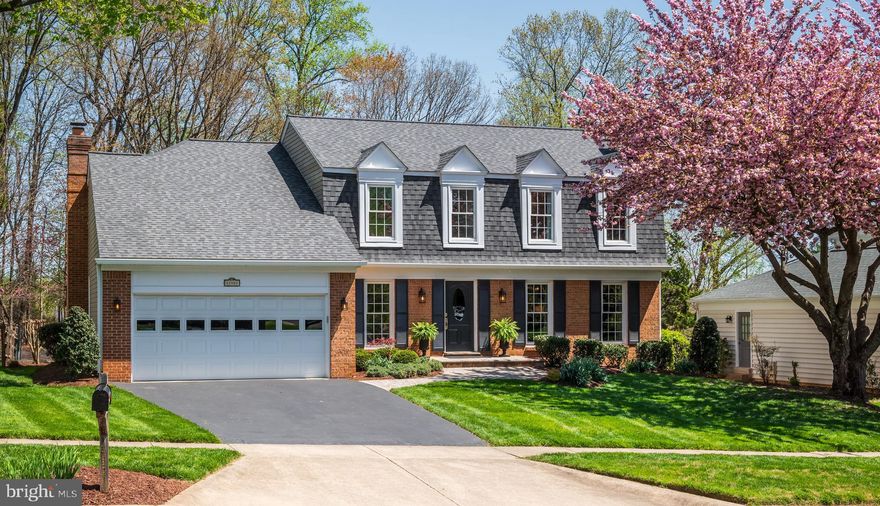 OPEN FRIDAY 4/25 4:00-6:00 and SUNDAY, 4/27 1:00-3:00! Discover and explore this exceptional 5 bedroom, 3.5 bath Colonial in the sought after community of Potomac Chase! Thoughtfully expanded and renovated with a two-story addition, this special home meets the demands of modern life converging luxury with natural beauty across three light filled levels, plus a beautiful outdoor oasis.
 
As you approach the residence, you’ll delight in the elegant curb appeal of the new architectural shingle roof, brick front façade, and lush landscape. A gracious paver walkway and stoop lead to the front entry. Once inside, an inviting foyer opens to incredible living space, including an expanded family room open to the gourmet kitchen. Ideal for gathering, the spacious family room offers beautiful vistas from a five-panel bow window, plus custom built-ins and window bench with storage, updated French door and a wood burning fireplace. The kitchen features custom maple cabinetry, quartz countertop with breakfast bar, new stainless appliances, a coffee/beverage bar station, ample storage and generous table space. The tremendous gathering area extends to the elegant dining room and “flex” room, an ideal office or living room with an abundance of natural light and beautiful wooded views. An updated powder room completes the main level. 
 
Retreat to the expanded upper level to find five bedrooms, two full bathrooms, a hallway with a custom built-in, spacious walk-in storage closet and access to the walk-in attic storage area. The luxurious primary ensuite includes a beautifully renovated bathroom with shower stall, double sink vanity with granite countertop, plus an expansive walk-in closet. The fifth bedroom, added as part of the two-story addition, features a vaulted ceiling, wall of windows and walk-in closet. The second, third and fourth bedrooms are spacious light filled rooms with sizable closets. A second renovated full bathroom features upgraded tile, vanity with granite countertop and oversized tub.
 
Relax and unwind in the light filled walk-out lower level, featuring a renovated multi-function recreation room, including a wet bar,  custom cabinetry with built-in refrigerator, granite countertop, and microwave. 
A second wood burning fireplace with elegant brick surround provides a stunning focal point. Ideal for everyday living and entertaining, this expansive room offers additional open space for gathering and enjoyment. The lower level contains a beautifully upgraded third full bathroom, plus a storage room with additional storage cabinets and workbench. 
 
The gracious indoor living extends to exceptional outdoor living. Gather with family and friends on the raised deck for an al fresco dining experience with the sights and sounds of nature. Enjoy morning coffee on the private paver patio. The lush .275 acre lot provides beauty and tranquility with substantial open recreation space, mature garden beds, and a tree-lined vista. Conveniently located in Potomac Chase,  you’re only moments away from nearby natural attractions, local area shops and restaurants, plus key commuter routes. Welcome and Enjoy!

Please note, the finished square footage of the two-story addition is not reflected in the property tax record.