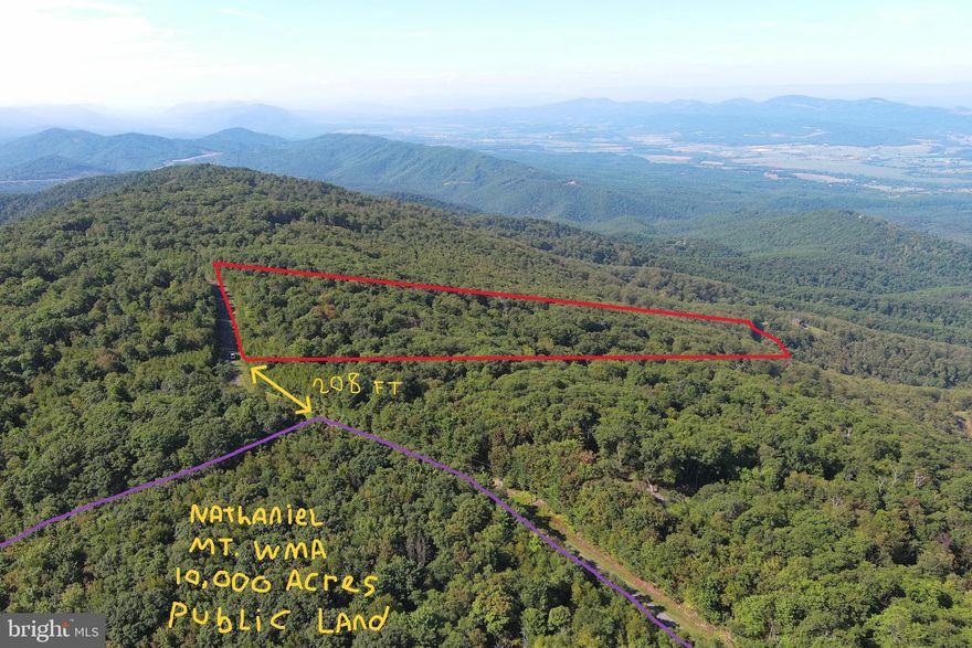 IT'S A DIFFERENT WORLD ON TOP......20 ACRES ELEVATED AT 3000 FT ATOP SOUTH BRANCH MOUNTAIN AND WITHIN 80 YARDS OF NATHANIEL MOUNTAIN WILDLIFE MANAGEMENT AREA, WHICH IS 10,000 ACRES OF PUBLIC HUNTING LAND OWNED BY THE STATE OF WV....AND THERE ARE SEVERAL HUNDRED ACRES OF GENTLE STATE LAND ON TOP OF THE MOUNTAIN TO ROAM & HUNT THAT'S FAR FROM ANY PUBLIC ACCESS.....YOU'LL PRACTICALLY HAVE IT ALL TO YOURSELF. EASY TO BUILD ON, POWER & PERKED, WON'T REQUIRE LONG STEEP DRIVEWAY, LOWER INFRASTRUCTURE COSTS THAN MOST LOTS. MASSIVE JAW DROPPING VIEWS TO THE WEST WITH TREE REMOVAL. IT'S WILD ON TOP OF THIS MOUNTAIN; BUCKS, BEARS & BOBCATS....OH MY! LOCATED IN THE PRESTIGIOUS 10,000 ACRE GATED COMMUNITY ASHTON WOODS, A ONE OF A KIND PLACE, WHERE YOU CAN ESCAPE THE WORK & WORRY OF THE BIG CITY AND TICKLE ALL YOUR OUTDOOR FANCIES....20 MINUTES FROM WAL MART, RESTAURANTS, 4 LANE SUPER HIGHWAY AND MULTIPLE PUBLIC ACCESS POINTS ON THE SOUTH BRANCH OF THE POTOMAC RIVER, 45 MINUTES FROM SKI RESORTS AND AN EASY 2 HOUR DRIVE FROM NORTHERN VIRGINIA. IF YOU LIKE THE OUTDOORS, YOU'LL NEVER GET BORED. TO SAY PROPERTIES LIKE THIS ARE RARE, WOULD BE A GROSS UNDERSTATEMENT....IF YOU LIKE LIVING YOUR LIFE ON TOP AND LOOKING DOWN ON CREATION....YOU'LL FEEL RIGHT AT HOME!