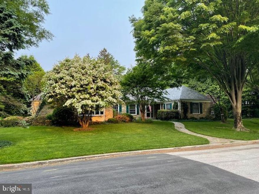 Pristinely sited on a picturesque, park-like setting in Baltimore’s desirable Orchards neighborhood, this  completely updated, beautiful stone residence offers three spacious bedrooms, three full and one half baths, as well as a two car garage.  Warm and inviting hardwood floors flow throughout a light filled, well-proportioned interior, thoughtfully designed for both comfort and entertaining. The bright, updated dine-in kitchen features quartz countertops, stainless appliances, a breakfast bar, and is complemented by the nearby spacious butler’s pantry with custom built-ins. The welcoming living room with wood burning fireplace opens seamlessly to the dining room; perfect for a gathering of any size.  The sun filled family room and home office feature exposed stone walls, lending warmth, texture and versatility.  Three well appointed bedrooms are located on the main level, as well as three beautifully updated full baths.  The convenient main level laundry adds flexibility and function.  The expansive lower level with half bath and attic area offer ample storage as well as future potential for added living areas.  A lovely flagstone patio overlooks the beautiful grounds of this exceptional Orchards residence that blends timeless character with stylish and sophisticated updates in one of Baltimore’s most sought-after neighborhoods.