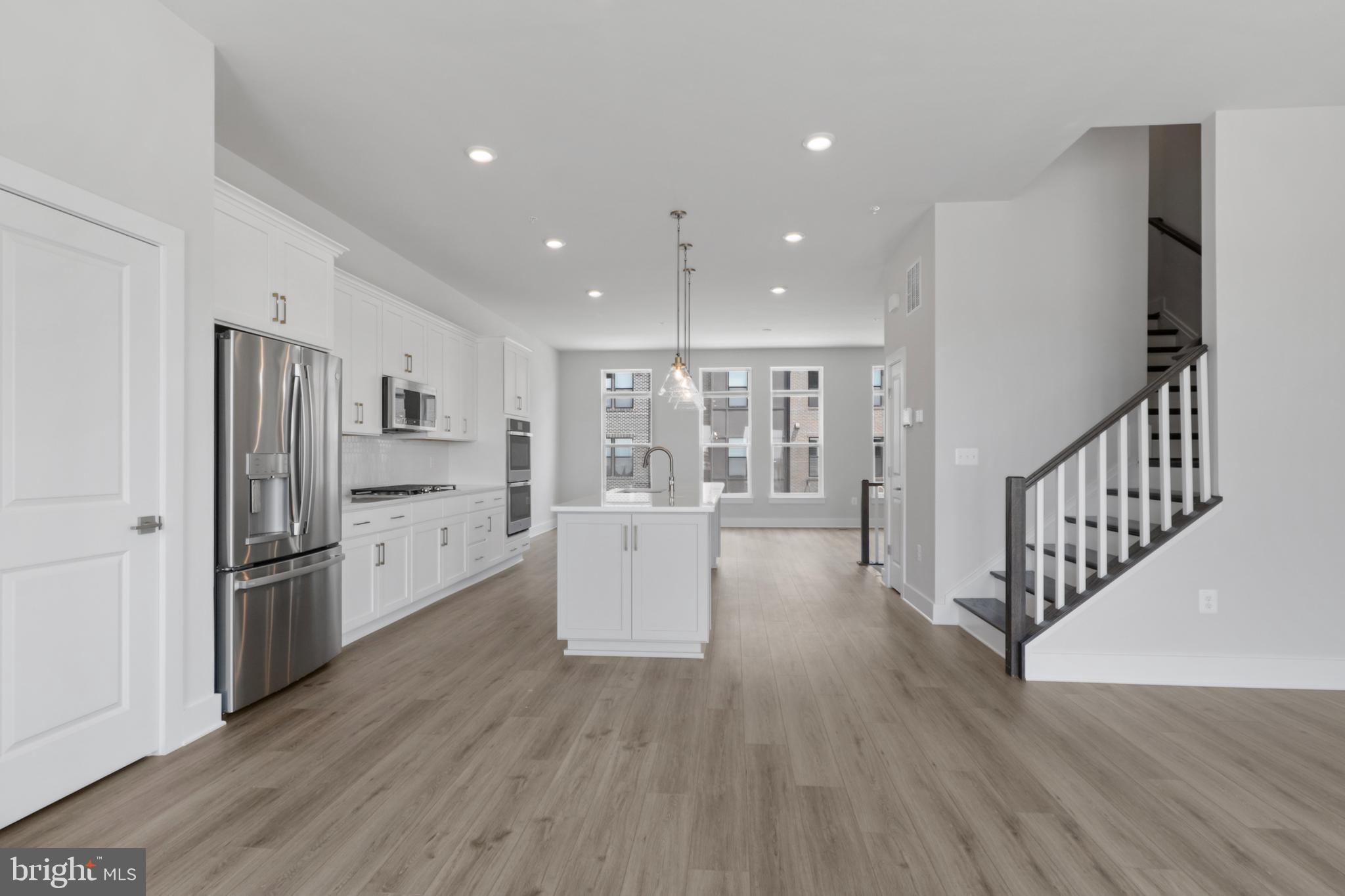 **Up to 40K IN FLEX CASH WITH USE OF APPROVED LENDER AND TITLE! Lower your price, cover your closing costs, or buy your rate down**Partial incentive applied towards price of home.**
Welcome to the Waterford, an elegant four-level townhome boasting an open-concept floor plan ideal for relaxing and entertaining. The main level features a well-appointed gourmet kitchen flanked by a large family room and casual dining area. With a stately island offering ample seating serving as the focal point, the main level overlooks large sliding glass doors leading to a 10 x 20 deck placed off of the rear of the home, where you'll enjoy panoramic views of the Patapsco River, Hanover Bridge and Marina. Upstairs, a sophisticated primary suite awaits, complete with a spacious walk-in closet, full bath with roman shower, and dual sink vanity. Secondary bedrooms and a shared bath are situated just down the hall, along with bedroom-level laundry and a linen closet. The Waterford also features a rooftop deck, accessible from the townhome's fourth-level loft. Leverage the Waterford's livability, wet bar and open rec room, the loft is ideal for entreating! On the entry-level, enjoy the convenience of a 2-car garage, rec room, and bedroom with full bathroom***THIS PROPERTY MAY QUALIFY FOR THE BROWNFIELD TAX CREDIT. WHICH COULD RESULT IN UP TO A 70% REDUCTION IN ANNUAL CITY PROPERTY TAXES FOR TEN YEARS*** See sales consultant for more information.