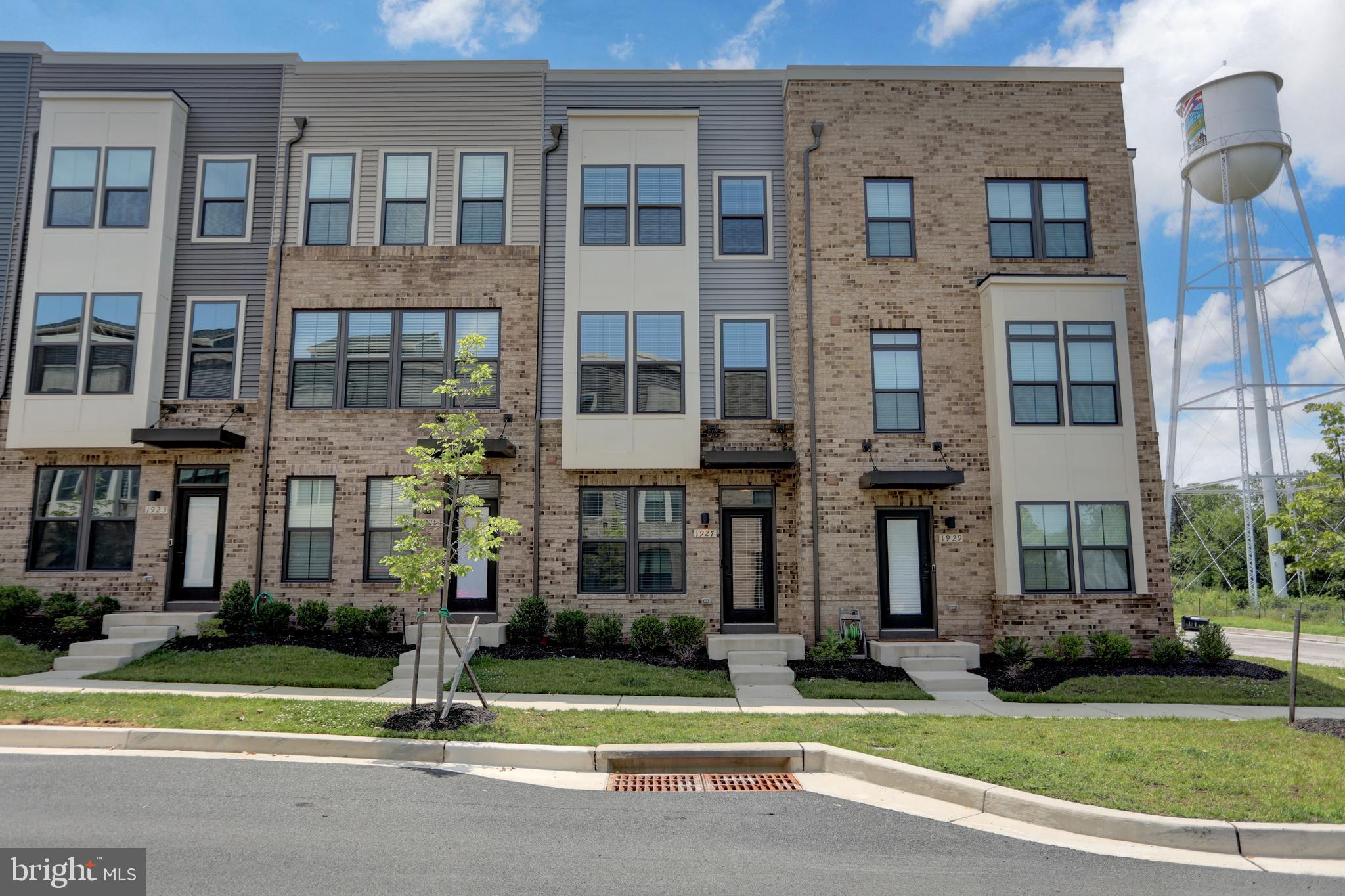 Move right into this stunning like-new Clarendon Urban 4-Story townhome in Foundry Station! Built just 2 years ago and barely lived in, this beautifully upgraded home delivers all the luxury.
Step inside to find a smart and flexible floorplan designed for modern living. The entry-level offers a spacious bedroom and full bath — perfect for guests, a home office, or private retreat — along with direct access to your one-car garage.
Upstairs, the heart of the home awaits. The gourmet kitchen is a chef’s dream, featuring elegant Downing Duraform Espresso cabinetry, sparkling granite counters, a stylish tile backsplash, under-cabinet lighting, and a premium GE stainless steel appliance suite with double-oven convection range. Wide-plank luxury vinyl flooring flows seamlessly into the dining area, where sliding glass doors lead to your private 7x14 deck — ideal for outdoor dining and entertaining.
Unwind in the inviting living room, complete with plush carpet and abundant natural light, or freshen up in the stylish powder room before heading upstairs.
The third level hosts the serene primary suite, boasting a spa-inspired ensuite bath and generous walk-in closet. A second bedroom, full hall bath, and full-size laundry area offer total comfort and convenience.
But wait—there’s more! The fourth level features a bright and versatile loft space, a fourth bedroom and full bath, and access to your private rooftop terrace — the perfect place to sip cocktails, stargaze, or enjoy sunset views with friends.
Tech-savvy upgrades include smart thermostat, Wi-Fi-enabled garage door, recessed lighting, dual cable/internet ports, and pre-wiring for TVs and ceiling fans.
With unbeatable style, space, and smart features — all in a vibrant, commuter-friendly location — this move-in ready home is truly a rare find.
Live better. Entertain in style. Welcome home.