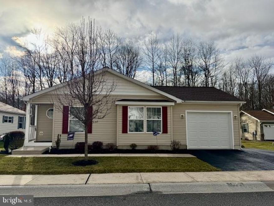 Move-in ready opportunity! Situated on a quiet cul-de-sac and backing to the community pond, 2 bedroom, 2 full bath manufactured rancher ("Turnbridge" model) offering 1,620+ sq. ft. of open and airy living space, located in the sought-after 55+ community of Cecil Woods with close proximity to Rt 40, I-95 and the shops and restaurants of the quaint and historical town of North East, Maryland. Features include an open floor plan with vaulted ceilings and crown molding throughout. Kitchen details include an island with seating, loads of beautiful cabinetry with tons of storage and prep space, double sink, recessed lighting and pantry. Located adjacent to the kitchen is an 11' X 22' great room with plenty of windows offering views of nature and the community pond. Additional details include 2 roomy bedrooms, including a primary with a walk-in closet and attached bath, as well as a second full bath and laundry room with convenient garage access. Exterior details include a composite deck with a Sunsetter retractable awning, oversized attached one-car garage and attractive landscaping. Upgrades include a recently added architectural shingled roof (1/2024), water heater and A/C unit. The active community center features a large clubhouse with a spacious gathering area and kitchen, library, exercise room, party room, billiards, picnic area with a pavilion and walking/jogging paths. Ground rent is $665.00 monthly and includes trash pick-up, public sewer and snow removal on the streets. Buyer must receive park approval from Cecil Woods (see documents for application). If you are searching for a well-kept home in a peaceful, friendly and walkable community, your search is over...22 Farragut Court...Welcome Home!!!