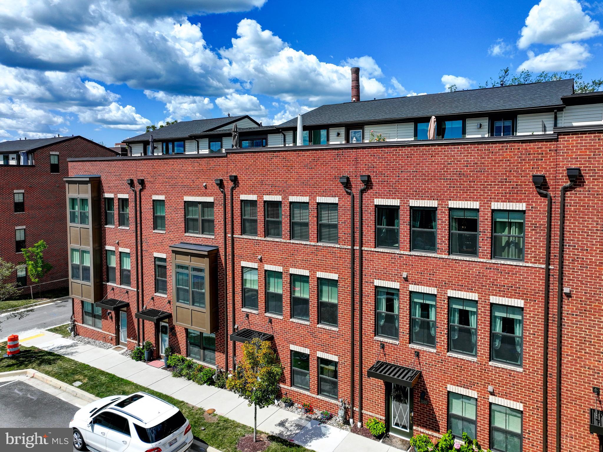 ***LARGEST PLAN***Located in the heart of Locust Point, this stunning brick front townhome offers four finished levels of modern luxury and thoughtful design. Less than three years old, the home features 4 spacious bedrooms, 3 full and 2 half bathrooms, and a rare 2-car garage. Inside, you'll find luxury plank flooring throughout—no carpet—recessed lighting, and a chef’s kitchen with stainless steel appliances, a large center island, and access to a Juliette balcony perfect for grilling. The home is loaded with upgrades, including a tankless hot water heater and a private rooftop deck ideal for entertaining or relaxing. Backing to trees for added privacy, this home blends comfort, convenience, and style in one of Baltimore’s most desirable neighborhoods. Enjoy being just steps from the shops at McHenry Row, including Starbucks, Harris Teeter, and THB Bagel Shop. Spend your free time at nearby Latrobe Park with its off-leash dog park and basketball courts, or take in the historic views at Fort McHenry—just minutes away.