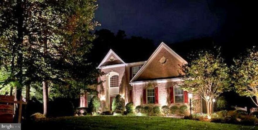 A place to work, relax & have fun, this meticulously maintained, resort-like colonial on a 2-acre wooded corner lot in a quiet community is designed for living your best life. Move-in ready, pristine, warm & inviting with large rooms, high ceilings, lots of sunlight & over $225K in upgrades. Grand foyer with curved staircase leads to 2nd floor walkway overlooking great room with cathedral ceilings, floor-to-ceiling stone-faced gas fireplace & floor-to-ceiling windows. Front of house has private home office with French doors & formal dining room. Oversized arched doorways open to eat-in kitchen with huge island, gas cooktop, walk-in pantry, quartz counters, double wall oven, cherry cabinets, add’l seating at island & bar. Full view of private yard from 1800 sqft connected outdoor living space-newly resurfaced commercial-grade deck with sunroom & covered patio (w/ spa) all constructed of maintenance-free PVC. Sun rises in front of house & sets in back. Keeping room great for music & formal sitting area. Kitchen & foyer staircases access 2nd floor & owner suite with sitting room, tray ceiling, walk-in closet, walk-in shower with frameless door, 2 quartz counter vanities; BR2 with walk-in closet, full ensuite bath with quartz counter; upstairs laundry room; BR3 with walk-in closet & shared dual vanity Jack & Jill bath with BR4 or 2nd home office. 2200 sqft walk-out basement finished to same quality as rest of house has in-ceiling sound dampening foam, conference room or 5th BR with walk-in closet, bathroom with granite counter & walk-in shower with frameless door, 26x23 home gym, huge living and recreation area, wet bar with granite and tile, storage room, and French doors walking out to covered patio. 35x27 basketball court. 3-car, side-entry garage has attic, tons of storage, 11-foot ceilings & commercial epoxy floor. New roof in 2016 30-year shingles. Bonuses: main level 5-inch finished in-place hardwood floors, ADT Pulse security + 9 camera security, professional LED exterior landscape lighting, custom blinds & paint in neutral colors including garage, recessed lighting, light fixtures, dimmers, ceiling fans, in-wall Taexx Pest control, 3-canister water treatment & softener, 12-zone sprinkler, commercial-grade wi-fi, MANY wired Internet connections, in-attic over-air antenna for whole house, in-house Xfinity, Verizon & DirecTV connections, ceramic wall & floor tile in all but main level powder room, in-ceiling or wall-mounted Bose surround sound speakers in 3 living rooms + outdoor patio speakers, interlock generator switch for backup generator, gutter screens.