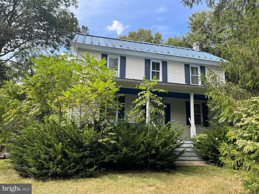 What a beautiful property this could be!! 1910 four square sited on 3.74 acres. Private backyard.  Owner leaving the area and will be selling this property AS IS, making NO repairs of any kind. Any personal property remaining at time of a contract, can be removed by the buyer, sold or trashed as they see fit.  We are working on other options for removal. There will be no expense to the seller for removal. There will be no interior pictures. Vehicles on property do not convey. 
Clear as much of the land as you want or stay nestled in the trees.  Two bedrooms w/2 bedroom septic approved, but downstairs room could be bedroom also,  or nice office! Large country kitchen and side porch as well as covered front porch.  This is a super chance for a  fixer-upper at this price,  with this much land. Restrictions include no chickens or pigs. Bring your update ideas!