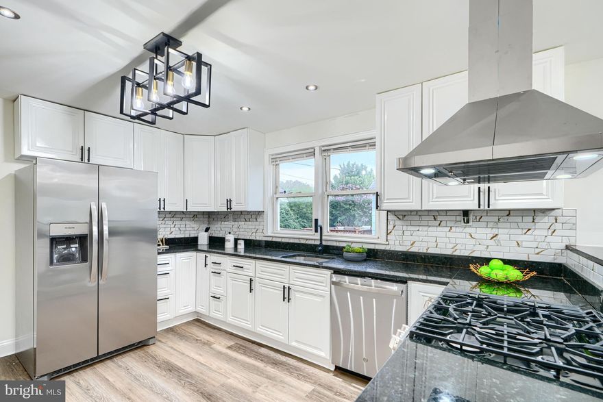 **OPEN HOUSE CANCELLED**Welcome to 5409 Hillburn Ave, located on a quiet street in the highly sought-after Hamilton community. This beautifully updated 4 bedroom, 3 bathroom home offers the perfect blend of comfort, style, and functionality. As you step inside, you're greeted by a stunning fireplace, abundant natural light, and a stylish accent wall that adds a touch of sophistication. The spacious living room flows seamlessly into the formal dining area, featuring modern lighting and an open-concept layout—ideal for both everyday living and entertaining. The gourmet chef’s kitchen is a true showstopper, boasting ample counter and cabinet space, sleek stainless steel appliances, and a convenient breakfast bar for additional seating. Two well-appointed bedrooms and a full bathroom are conveniently located on the main level, perfect for guests or multigenerational living. Upstairs, you'll find a generous primary suite complete with a luxurious en suite bathroom. The fully finished basement extends the living space with a large rec room, an additional bedroom, a full bathroom, and a dedicated laundry room. Step outside to your private oasis, where a charming front porch and a rear deck overlook an expansive backyard—perfect for outdoor gatherings and relaxing evenings. Don’t miss the opportunity to make this exceptional property your new home!