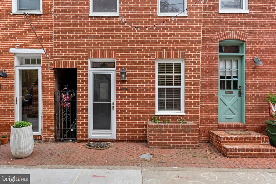Welcome home! This charming and cozy  home sits on a quiet court in  Federal Hill's historic district. Rest assured you will feel safe and secure as this home is tucked away with no pass through traffic. Street string lights add illumination and ambiance at night! Minutes from M&T Bank Stadium & Camden Yards! With 2 bedrooms and 1 full bath, this adorable home features a large, newer deck, gas stove, hardwood floors, and newer HVAC (2016). Move right in, and start enjoying all the culture, dining and entertaining that Federal Hill has to offer!