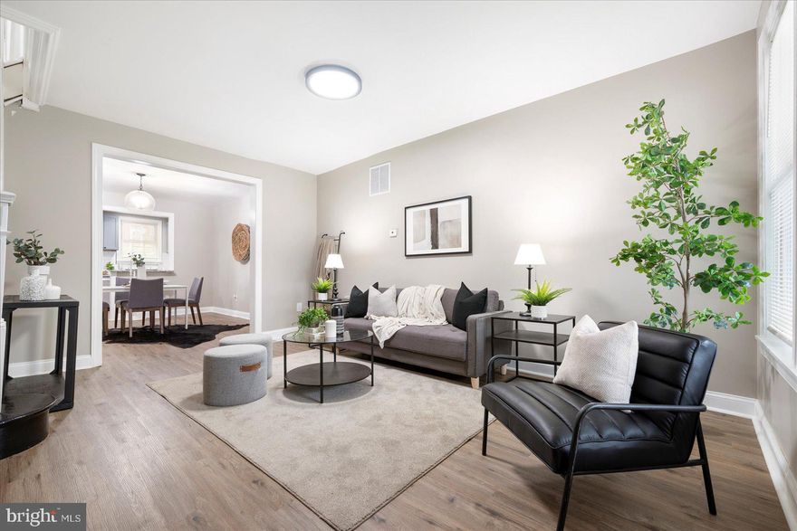 Welcome to your dream home where style meets affordability in the heart of the city! This beautifully renovated, porch front rowhouse offers the perfect blend of modern convenience and classic charm. Step inside to an inviting open floor plan on the main level, featuring a spacious living room, a formal dining area, and a chef’s kitchen equipped with a peninsula bar – ideal for entertaining and everyday living. Upstairs, you'll find three generous bedrooms and a custom-tiled full bathroom, designed with comfort and elegance in mind. The fully finished lower level adds even more living space, boasting a fourth bedroom, a second full bathroom, and a dedicated laundry area. Enjoy a large backyard perfect for relaxing or hosting gatherings.