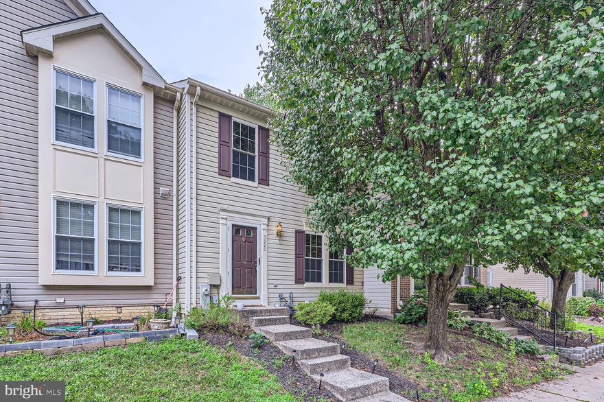 Newly refreshed and move-in ready 3BR/1.5BA townhome located in the tree-lined neighborhood of Castlestone at White Marsh!  Park just outside the walkway that leads to the front door of your forever home.  Step into a bright and airy main floor boasting gleaming floors and tons of natural light.  A large living room with views into the spacious dining room and kitchen.  The kitchen boasts plenty of cabinets, stainless steel appliances, and a double stainless sink under a window.  On the second floor is a spacious primary bedroom with vaulted ceiling and large walk-in closet, two sizable secondary bedrooms, and a full bath. The finished lower level boasts additional living space offering a spacious family room, laundry, storage, and sliding doors to a covered patio in the fenced yard.  There is a storage closet that has a rough-in to covert to a bathroom if wanted. From the main floor step outside onto a large wood deck that overlooks a yard filled with green space and possibilities.  This home is move-in ready with so much to offer new homeowners and is located in close proximity to shopping, restaurants, and commuter routes.