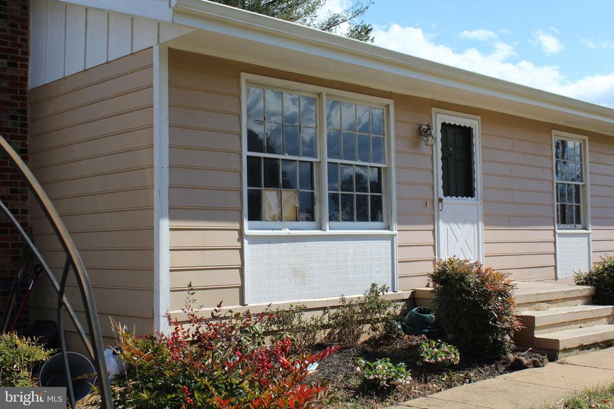 SELLER SAYS MAKE AN OFFER! WITH REMODELING/REPAIRS THIS RAMBLER ON 1.57 ACRES WOULD MAKE A GREAT INVESTMENT/RENTAL PROPERTY.   NEED TLC BUT HAS TONS OF POTENTIAL.  SELLER IS SELLING STRICTLY "AS IS, WHERE IS".  MAIN FLOOR FEATURES KITCHEN, LIVING ROOM, 3 BEDROOMS AND 1.5 BATHS.  THE FULL BASEMENT IS WALK OUT LEVEL ON THE SIDE AND IS HAS SOME FINISHED AREA.  LAUNDRY IN BASEMENT.  FLUE AND WOOD STOVE IN THE BASEMENT.  BEING SOLD "AS IS".