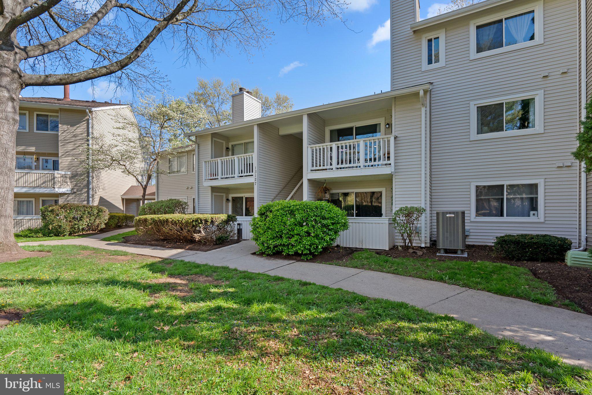 LOOKING FOR A HOME THAT HAS BEEN LOVED BY THE OWNER AND JUST "FEELS LIKE HOME" FROM THE MOMENT YOU WALK IN? THIS IS THAT OPPORTUNITY! LOCATED IN NORTHWEST HS DISTRICT! This wonderful, first-floor 2 bedroom/2 bathroom condo is in an ideal location in a courtyard. This home has been lightly lived in and meticulously cared for, not an easy thing to find! Enter this freshly painted, tastefully decorated home and you are immediately greeted by the beautiful LVP flooring (2022) and open floor plan. The kitchen features updated dishwasher & fridge (2020), brand new disposal and lots of counter and cabinet space. The dining area is conveniently located right next to the kitchen and has had chair railing recently installed, The family room is immediately off the kitchen and features a wood-burning fireplace, and slider opening up to private patio. Large primary bedroom with bathroom, secondary bedroom is good size as well. Washer and dryer were installed in 2020. AMENITY-RICH NEIGHBORHOOD featuring community pool, sauna, fitness center, playground, basketball court and nearby parks & walking trails. PARKING features 1 assigned spot plus extra permit to park in unreserved spots. GREAT GERMANTOWN LOCATION, close to grocery stores, shopping, parks and restaurants. Close to I-270 and other commuter routes. Germantown MARC station is only 5 minutes away, Shady Grove Metro is a short 15-minute ride.