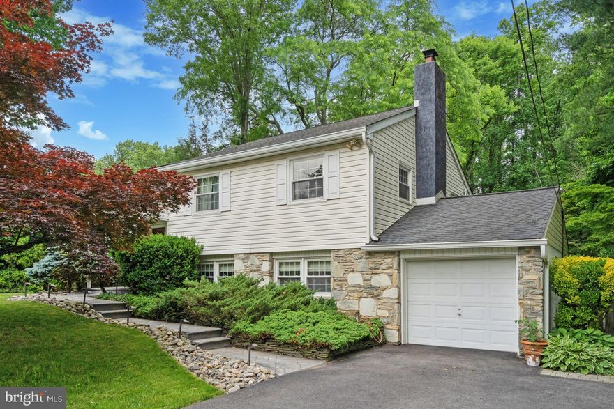 Nestled in the highly sought-after Aidenn Lair neighborhood of Dresher, PA, this immaculate 4-bedroom split level home offers the perfect blend of modern upgrades and classic charm. Situated on a private, landscaped half-acre lot with a fully fenced yard, this property provides a serene oasis just minutes from top-rated schools, shopping, and major commuting routes. Step inside and be greeted by an open and inviting floor plan ideal for entertaining. The spacious living room flows seamlessly into the dining area, creating a warm and welcoming atmosphere. The true heart of the home is the gourmet kitchen, boasting sleek stainless steel appliances, a stunning Blue Star gas range and range hood, ample cabinet space and a large picture window overlooking the impressive back yard. Offering four generously sized bedrooms, there’s plenty of space for the whole family. The primary bedrooms offers your own private ensuite bath with a tiled shower, and an additional updated full bath can be found in the hall for kids and guests. In the 4th bedroom you’ll find access to a floored attic for additional storage. Downstairs, relax by the fireplace and unwind in the cozy family room with its warm ambiance. From here, you can access the convenient powder room and separate laundry and storage rooms. Exit out the laundry room to access the one-car garage and large driveway. Outdoor living is taken to new heights with the multi-level deck and pergola, creating the perfect space for alfresco dining and entertaining. Soak away your cares in the brand new hot tub, installed just two years ago. The lush, landscaped grounds offer a private retreat from the hustle and bustle of everyday life. Don't miss your chance to make this exceptional home yours. Schedule your private showing today and experience the epitome of suburban living.