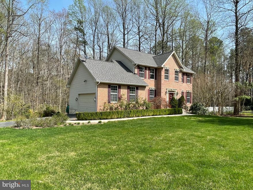 Experience the charm of this beautifully maintained classic brick colonial home in Huntingtown. With four bedrooms, three and a half bathrooms, and 3,800 square feet of living space, this home is perfect for families, professionals, or anyone looking for comfort and style. The main level features an open floor plan that seamlessly connects the family room, dining area, and kitchen. The family room is cozy yet elegant, with a fireplace, large windows that let in plenty of light, and hardwood floors. The dining area is perfect for entertaining, with enough space to seat 6-8 guests comfortably. The kitchen is a chef's dream, with modern appliances, granite countertops, and plenty of storage space. The kitchen also features a breakfast bar and a separate eating area that overlooks the backyard. Upstairs, you'll find three bedrooms, including a spacious master suite with a large walk-in closet and a luxurious ensuite bathroom. The other two bedrooms are comfortable and cozy, with plenty of space for a growing family or guests. The finished basement includes a large bedroom, family room and wet bar/kitchen (no stove). Outside, you'll enjoy a large yard that's perfect for barbecues, outdoor games, or just relaxing in the sun. The backyard is surrounded by mature trees, offering privacy and tranquility. Additional features of this beautiful rental home include a two-car garage, central air conditioning, and a laundry room with a new washer and dryer on the main level. Located in the highly sought-after Huntingtown school district, this home is close to shopping, dining, and entertainment options. With easy access to major highways and public transportation, commuting to work or school is a breeze. Don't miss this opportunity to live in one of Huntingtown's most desirable neighborhoods. Schedule a showing today! Landlord prefers a credit score of 700 or above.