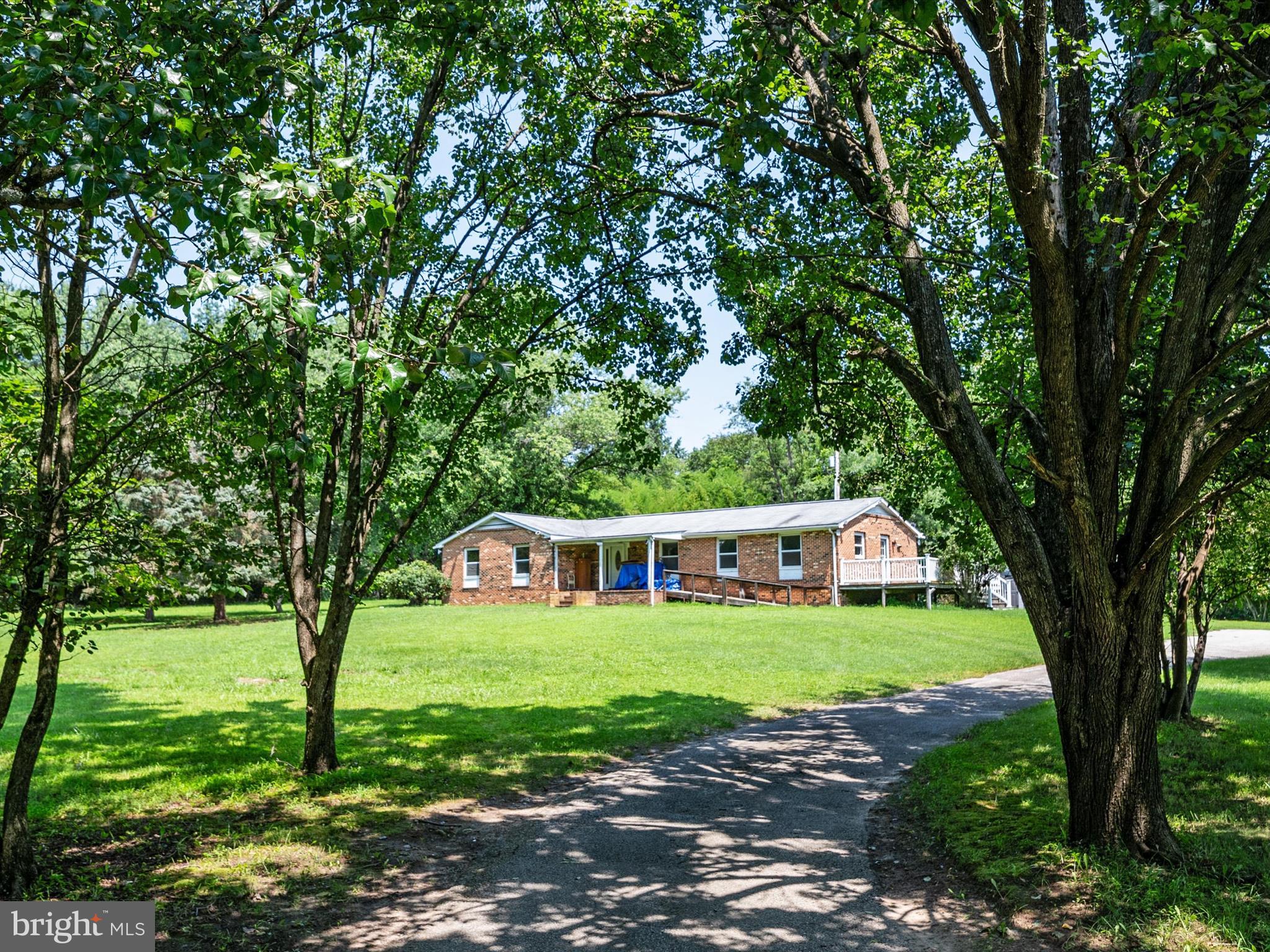 Escape to Your Own Private Retreat on Over 11 Acres in Gambrills!
Welcome to 2182 Johns Hopkins Rd — a rare opportunity to own a spacious 4-bedroom, 2-bath home nestled on 11.03 acres in sought-after Anne Arundel County (sold as-is). Built in 1985, this rancher offers 2,088 square feet of finished living space on a single level, including a bright, open layout, an eat-in kitchen, generously sized bedrooms, and dual closets in the primary suite. Multiple living areas provide plenty of space to relax, work, or entertain.
Enjoy the serenity of a tree-lined property that includes a large barn , an unfinished basement with a sump pump, and parking for 10+ vehicles. Utilities include a well and septic system, electric baseboard heating, a Rheem 50-gallon hot water heater, and a Kenmore electric dryer.
Ideally located in a well-established community, this home offers the perfect blend of privacy and convenience—just minutes from major commuter routes including Route 97, Route 50, and BW Parkway, with easy access to BWI Airport, shopping, dining, and top-rated Anne Arundel County schools.
If you’ve been searching for space, potential, and peace of mind, this is the property you’ve been waiting for. Schedule your private showing today!