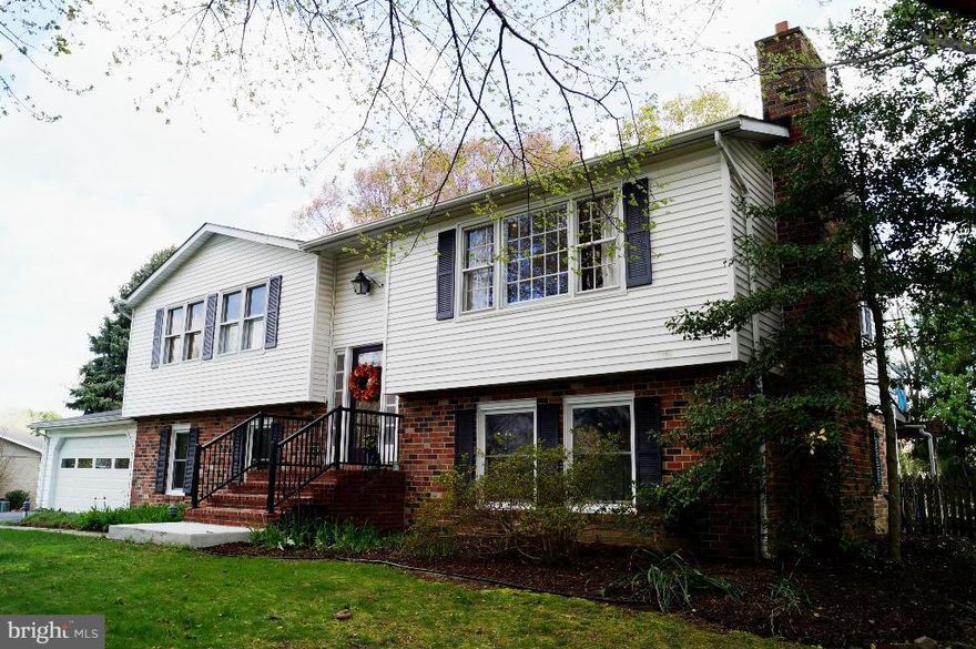 Beautiful and updated split level home features gorgeous wood floors, gourmet kitchen with granite counters, island & track lighting, and two wood-burning FP! DR opens via French doors to deck. LL fam room has tons of space, fireplace, and a spacious office/opt 4th bedroom. Nice big laundry area with tons of storage! Backyard oasis features a lovely deck and in-ground pool, patio off lower level.