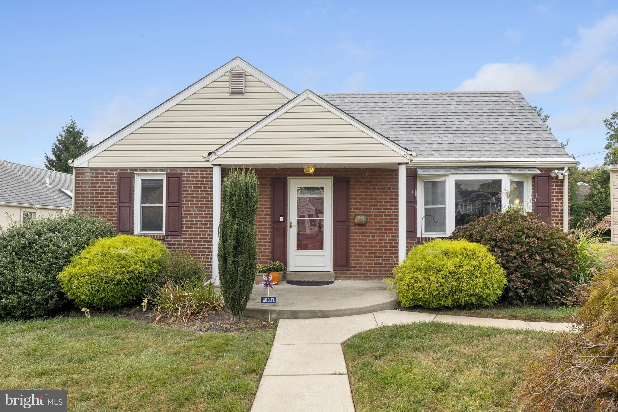 Welcome to this charming and meticulously maintained 2-bedroom, 1.5-bathroom home nestled in the highly sought-after Marple Gardens neighborhood. This delightful residence offers the versatility to easily function as a 3-bedroom home with its spacious finished lower level, making it perfect for growing families or those in need of extra space. As you approach the home, you'll be immediately struck by its fantastic curb appeal and a beautifully landscaped front yard. Step inside to discover an immaculate freshly painted interior, where gleaming hardwood floors flow seamlessly throughout the main living areas, creating a warm and inviting atmosphere. The heart of the home is the spacious updated, eat-in kitchen, which boasts ample cabinetry, modern appliances, and plenty of counter space for meal preparation. It's the perfect spot for casual family breakfasts or entertaining friends over dinner. The double-sized owner's suite is a true retreat, offering generous space for relaxation and rest. Enjoy a recently updated hall bath with direct access to the owner's suite. The additional bedroom is equally well-appointed, providing comfort and privacy for family members or guests. The finished basement, currently utilized as a bedroom, includes a convenient half bath, adding to the home's flexibility and functionality. One of the standout features of this property is the stunning outdoor space. The beautiful patio overlooks a flat, grassy lot, ideal for outdoor gatherings, barbecues, or simply enjoying a peaceful afternoon in the sun. The new roof and newer replacement windows ensure that the home is not only aesthetically pleasing but also energy-efficient and well-maintained. Located within walking distance to the vibrant stores and restaurants on West Chester Pike, this home offers the perfect blend of suburban tranquility and urban convenience. Whether you're looking for a cozy family home or a versatile space to accommodate your lifestyle, this Marple Gardens gem is sure to impress. Don't miss the opportunity to make it your own!