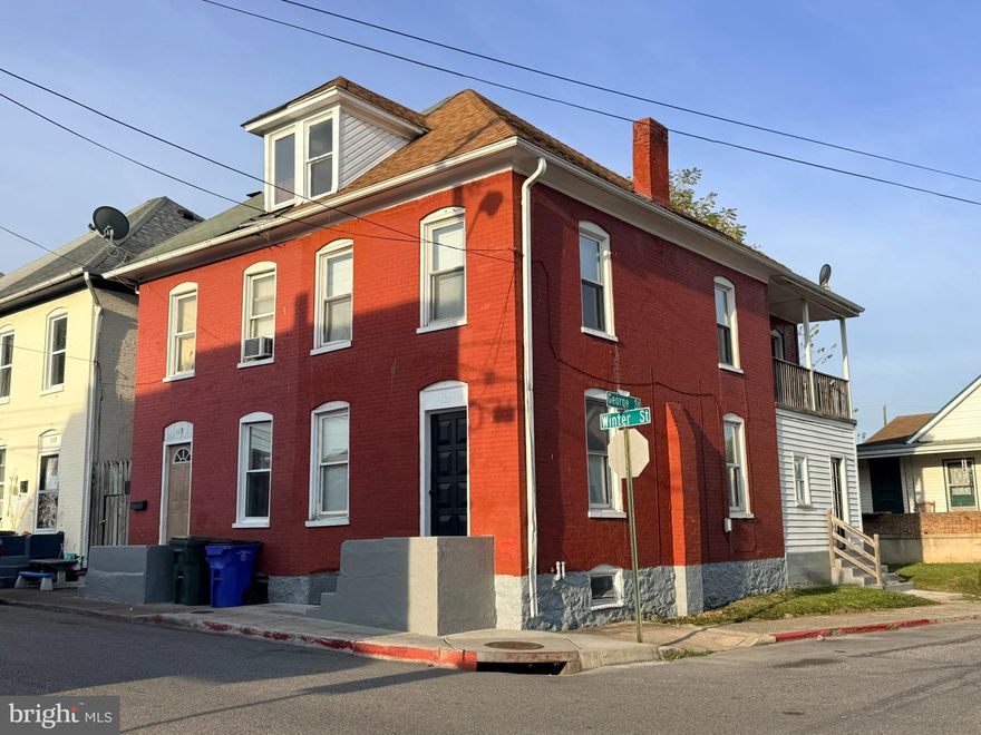 All-brick corner home featuring two bedrooms and one bath, offering a total of 1,170 square feet. The property includes generous storage, a convenient mudroom, and all replacement windows. Refinished wood floors add warmth and character throughout. This home shows beautifully and is ready to move in. Why pay rent when you can own? Take advantage of a city grant opportunity. The walk-up attic provides additional storage space.