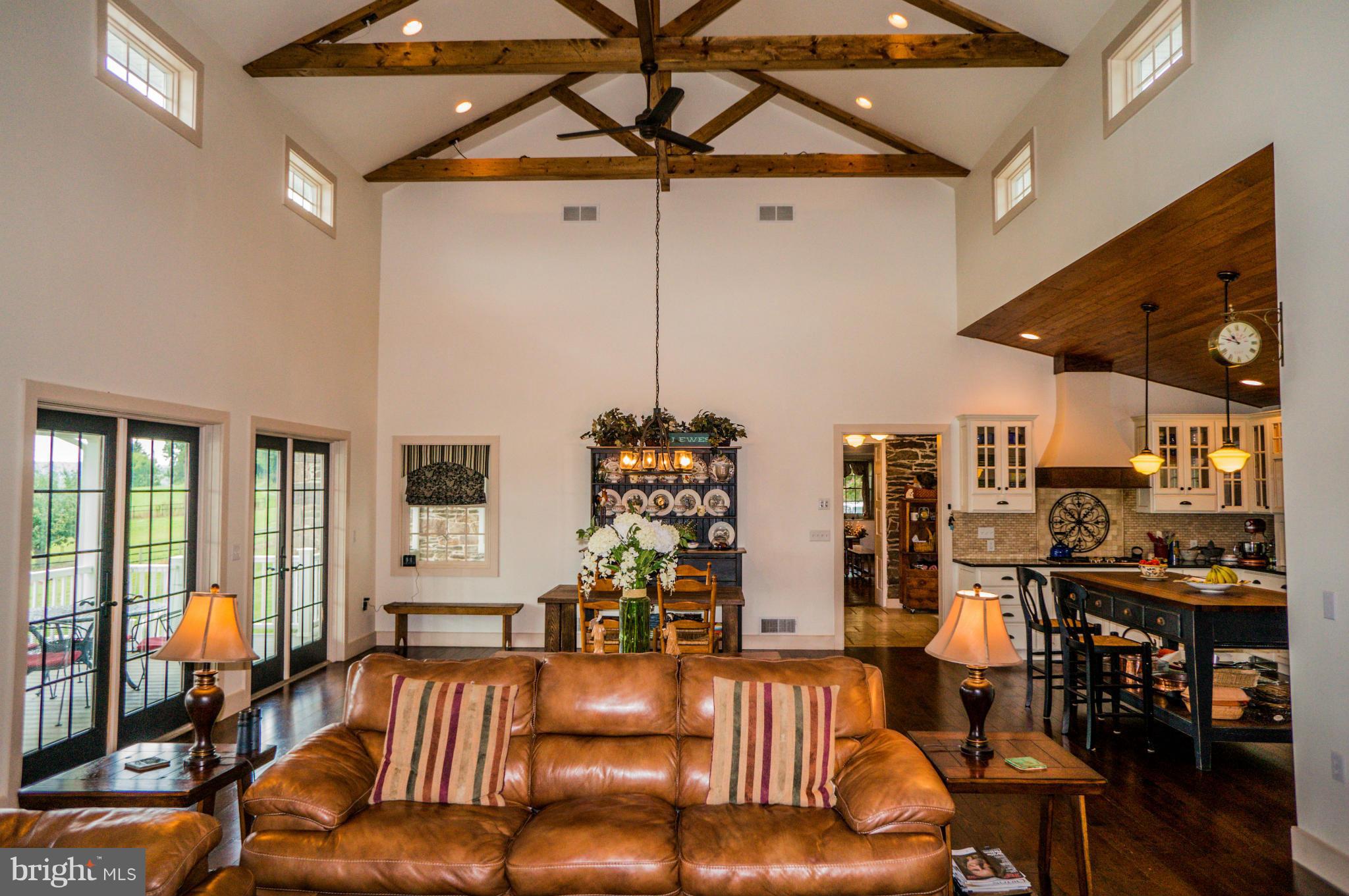 Review the pics of this beautiful 120 acre farm & fully upgraded stone Victorian home. Farm features 86 acres of tillable land & large bank barn with horse stalls. House features open family and dining room with cathedral ceiling displaying exposed wood beams. Four sets of French doors line the wall opening onto a covered porch with stunning views. Modern country kitchen includes granite counters.