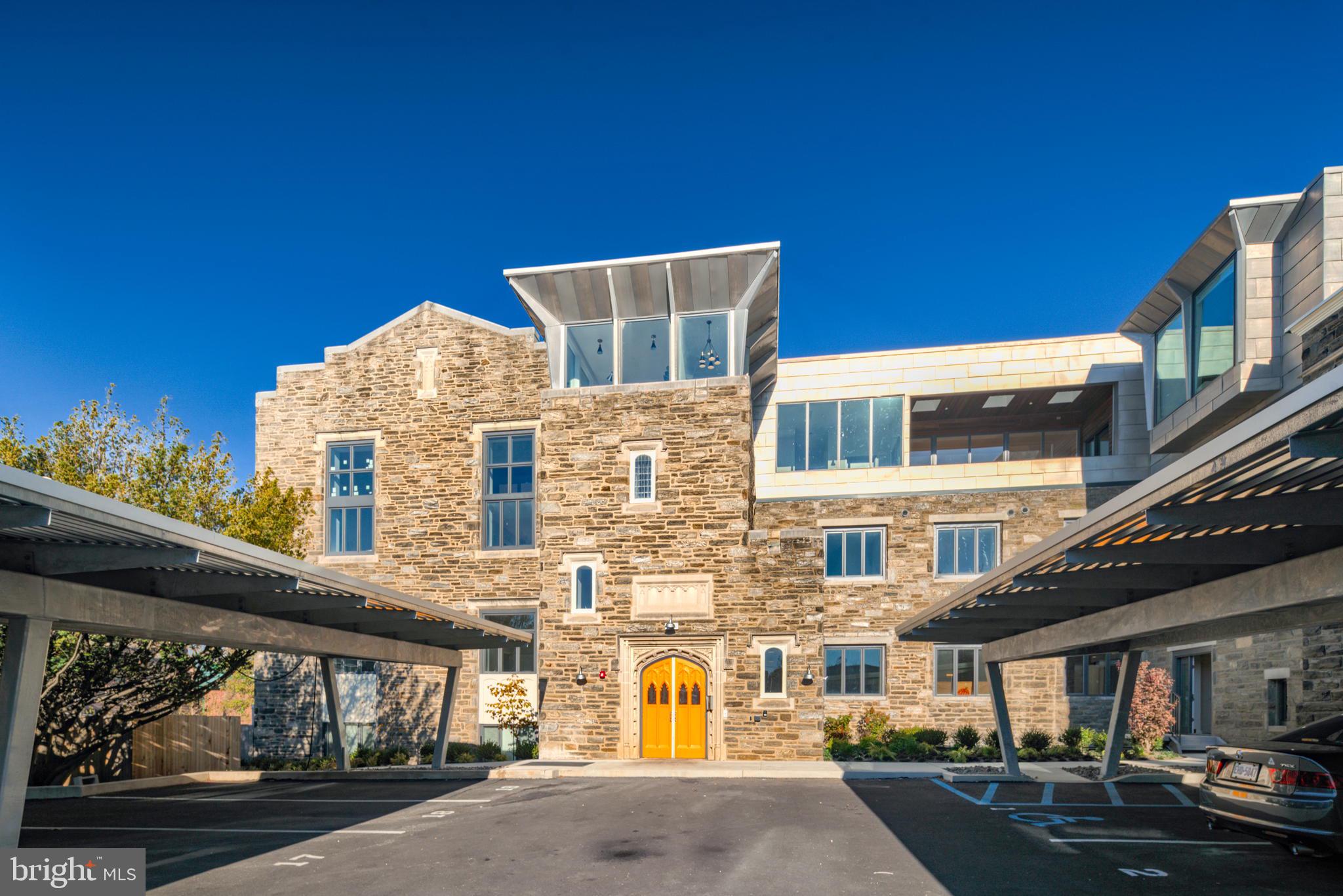 ONLY 2 (out of 19) UNITS REMAIN at this stellar condominium project in a most desirable Mt Airy location. With significant character and included covered parking, this development is the culmination of the adaptive reuse of a century-old church annex, showcasing a Wissahickon schist exterior with a newly constructed fourth floor addition; all new systems; large, smartly laid out spaces; ample and balanced light; beautiful, tasteful finishes; and low operating costs (utilities, taxes, condo fees). 7111 Germantown is easily accessible to so many restaurants, cafes, retail, parks, shopping, library, and more. 5-minute drive to the Wissahickon Valley and miles of wooded trails. 5-minute walk to two SEPTA regional rail lines. And, of course, a quick ride to Chestnut Hill, Center City, Manayunk, and the Main Line. Extremely low taxes, condo fees, and utility costs in this energy efficient project. Superior construction includes extra insulation and advanced sound attenuation methods. This is an elevator building and is pet friendly. This spacious ground level residence offers 3 bedrooms, 2 baths, and a most desirable split plan layout. Private Patio. Big windows, open floor plans, excellent space and light, spectacular finishes, ample closets, and storage. Every unit comes with an assigned covered parking spot (with EV charging available). Upgrade to a 2-car tandem parking space for $25,000. Full TAX ABATEMENT through 2032. Floorplans available for all units.
