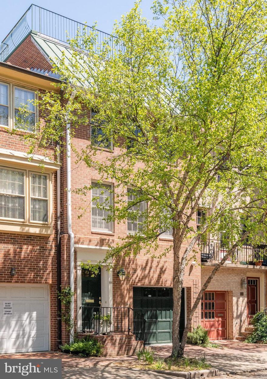 Exquisitely maintained 4 level townhouse located in the heart of Old Town just a few steps to the waterfront and three blocks to the shops and restaurants of King St.  The outstanding and unique feature of this beautiful  home is the large roof top terrace,  accessed via a staircase, that provides ideal entertaining space and panoramic city and river views.  The property offers 3 spacious bedrooms, two of which are master suites, 3.5 bathrooms, an elegant living room with a separate dining area, a lower level family room and a light and bright south-facing kitchen.  French doors in the living room open to a handsome brick and flagstone patio with fountain and pond.  Features  include gleaming hardwood floors, high ceilings in the living room, two gas fireplaces, an electric log fireplace and mantel  in den, dry bar, living room and family room built-in bookcases, fitted office workspace in Bedroom 3, Jacuzzi tub in master bathroom, surround sound system and speakers, in-ground garden irrigation system, exterior patio lighting and extensive storage throughout.  Recent replacements include a new 2-ton HVAC unit for the lower floors, new AC compressor in upper system, water heater, custom built skylight, brand new 4th level carpet and a new induction electric cooktop.  An extra deep single car garage with more storage potential and driveway parking for a second car makes for perfect Old Town living!