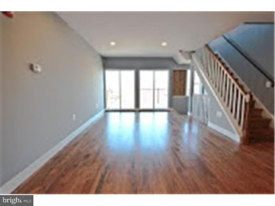 Experience the "Rufo Finish" offering a 10 year TAX ABATEMENT and find out why this outstanding design/build company has over 50,000,000 in residential sales in Bella Vista and Hawthorne alone. Unit 301 is a brand new construction bi-level condo in the beautiful Bella Vista/Hawthorne neighborhood. An inviting open floor plan living/dining area leads into a modern kitchen with stainless steel appliances, and gleaming high end espresso finished cabinetry. This set-up is perfect for conversing with friends and family while preparing a meal. The spacious deck lends itself to growing herbs or alfresco dining. Two cozy bedrooms with plenty of natural light and ample closet storage are towards the front. A bathroom with lavish fixtures and a porcelain tub/shower combo round out this home. Hardwood floors, and high end finishes can be found throughout.  Valuable storage space is captured in every possible area adding to the livability of these beautifully designed units. Described as a "walker's paradise" with a walk score of 91 and "flat as a pancake with good bike lanes" with a bike score of 90, and a transit score of 80. Just three blocks from the 9th St. Italian Market, the oldest operational open air hub in America. The close proximity to Whole Foods market, trendy South St. shopping, some of the city's best brunch spots, and over 200 restaurants less than a 15 minute walk away, make it center city's most livable neighborhood. A parking space is available for $150 per month.