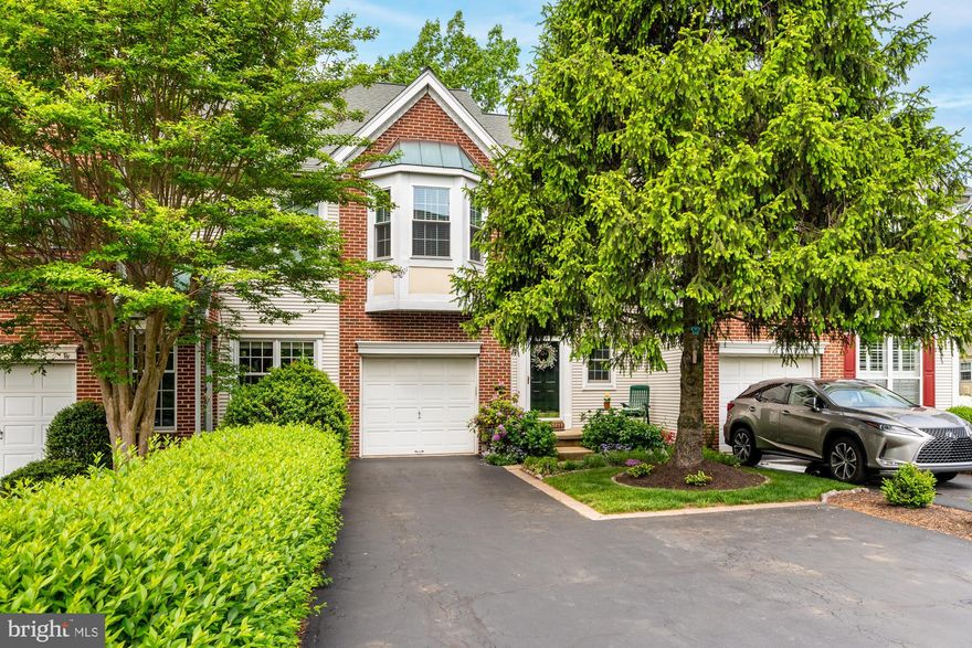 Welcome to 104 Lemonton Way, a bright and well-maintained townhouse privately nestled in the desirable neighborhood of Rebel Hill. Living in this lovely 2 bed/2.5 bath home, you’ll be able to experience  the best of city and suburban life with easy access to Philadelphia and the Main Line.  As you approach the residence, notice the perennial garden, soon to be bursting with colorful blooms, and how it sweetly enhances the front curb appeal. Step inside to the sunny foyer with its neutral toned hardwood floors. A walk-in closet, half bath and garage access are conveniently located nearby. From the foyer, your eyes are drawn ahead to the floor to ceiling windows of the two-story living room with picture perfect framing of the trees and the views beyond. A gas fireplace with stately mantelpiece contributes to the welcoming and warm ambiance of the home. Enjoy dinner parties and family gatherings in the formal dining room. The kitchen, graced with neutral wood cabinetry, black granite, hardwood floors, stainless appliances and breakfast bar, is open to the living room, making entertaining a breeze. Glass sliders lead you out to the low maintenance deck, perfect for dining and relaxing al fresco while enjoying peaceful and serene views, some of the best views in all of Rebel Hill. Upstairs, the spacious primary bedroom has a cathedral ceiling, hardwood floors, walk-in closet and a gracious bay window. The en-suite primary bath is well appointed with a double vanity, large walk-in shower, soaking tub, and a separate water closet. Right outside the primary is a designated laundry room, so conveniently located. Completing this floor is the second bedroom, full hallway bath and linen closet. The oversized daylight finished basement offers additional versatile living space. It’s spacious enough for another bedroom plus an office space, family room or home gym, whatever your needs may be. In addition to the 1-car garage, the driveway has more than enough space for two cars. Low HOA fees cover lawn and common area maintenance, snow removal and trash. Don’t miss this opportunity to experience a carefree and cultivated lifestyle with quick access to major routes, train stations, healthcare, higher education, world class shopping, restaurants, hiking and biking trails and more!