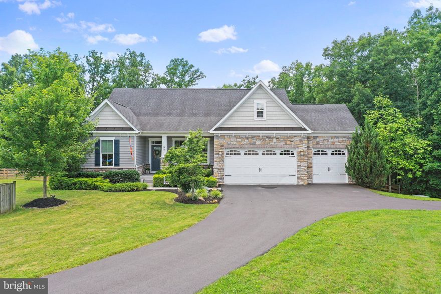 Beautiful Four (4) Bedroom Home on TWO (2) acres in the sought after community of Brookfield on the Potomac.  There are three bedrooms, including primary, on the main level with two full baths.  The primary suite has a deluxe bath with tile shower.  There is a large loft, large bedroom and third full bath on the upper level. This contemporary style home features open floor plan, stone and vinyl siding, large deck, lower deck with hot tub and stairs to yard/patio from the walkout basement, ready to finish with a rough in for 4th bathroom.  The gourmet kitchen features double wall ovens, cooktop, granite counter tops, peninsula with breakfast bar. There is a breakfast room and large formal living room with gas fireplace.  The main level features hardwood flooring throughout and tile in the bathrooms.  You will find ample parking in your three-car garage that is EV charger ready with 240v outlet, and paved driveway with turn around.  The home sits back off the street for privacy and part of your yard is fenced and part wooded, there is a large shed and a firepit for s'mores and stories on summer nights. Community has many amenities including but not limited to deeded access to river amenities with boat ramp, picnic pavilions, volleyball, baseball, and playground.  Easy access to I81, Maryland, Virginia. Great commuter location or work from home with Xfinity internet.