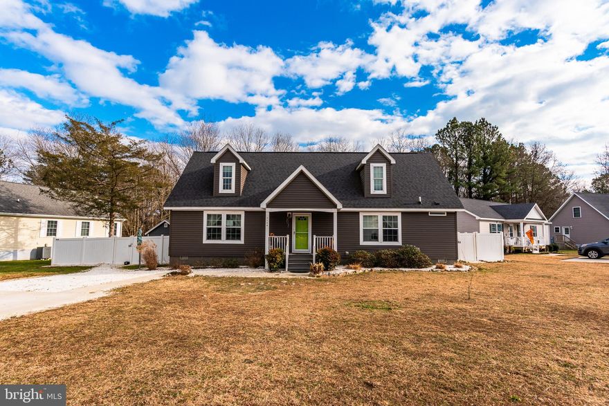 OPEN HOUSE:  SATURDAY, February 7th 11am-1pm.  7148 Arcadia Circle in Arcadia Village!  A charming Cape Cod in a small neighborhood in Newark, Maryland.  Just a 10 minute drive to the historical town of  Snow Hill, Maryland and only 10 minutes to the historical town of Berlin, Maryland, named America's Coolest small town in 2014.  From Newark, you can easily enjoy all that Worcester County, Maryland has to offer.  From the quaint small towns, to an abundance of public parks, to Assateague Island to Ocean City's famous boardwalk.  Arcadia Village is a small neighborhood offering an open common area at the center of the community for the gathering of its' residents and VERY easy access to Newark neighborhood park! On the main floor of this lovely cape cod you'll find a large, bright and cheery living area with open kitchen and lots of light from the large windows.  The kitchen features warm cabinets, long running counters, center island, table area and LVP flooring.   On the main floor there are 2 bedrooms and 2 FULL baths.   The primary suite on the main floor offers lots of closet space and a private bath with walk-in shower.  Upstairs there is the potential of 2 additional bedrooms with a shared bath.  The back yard offers nice entertaining space and a large shed for storage and backs to trees for privacy.