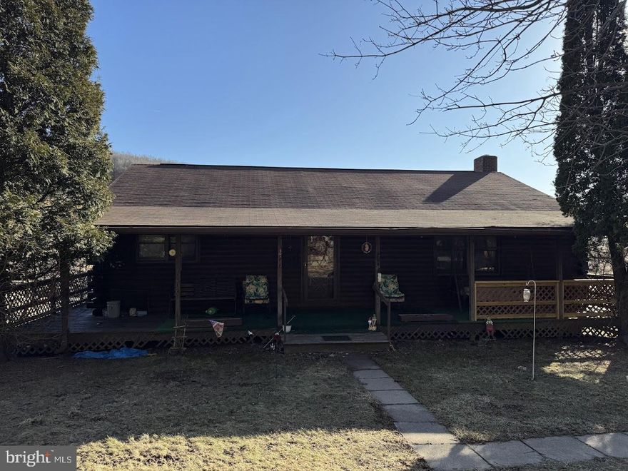 Located between Oakland and Deep Creek Lake, this log ranch is situated on 14.82 acres, including a stream, pond, barn and outbuildings with many possibilities to include potential subdivision configurations. The log home needs some TLC and updates; it is being sold as part of an estate. Some items of personal property remain in the house and on grounds. Those items are being removed. More photos will follow once the interior is emptied. The property will be sold AS-IS.