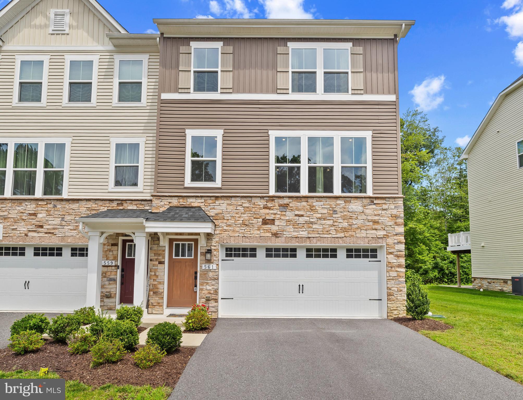 Semi-Detached Beauty in Quiet Waters at Norman Creek. This Stunning, Stone-Front Townhome offers a perfect blend of Quiet privacy, Spacious Living, and a Serene Walk-able community. Steps away from the waterfront at Norman Creek. This Spacious 3 bedroom, 2 full bathroom, and 2 half bathroom Home offers Tons of Natural light. With an Open floor plan, the main level is Adorned with hardwood flooring throughout. Your Well-Appointed Open Kitchen flows right into the Large Dining area. Complete with Gleaming Quartz Countertops, a dedicated Coffee/Tea nook, Lovely White Cabinetry, Stainless Steel appliances, and an Oversized Island that can comfortably seat 5 or more; Large enough to entertain your Family and Friends!! Also, an optional Bonus open Office Space on the main level provides flexibility for work or a study, with an adjacent Powder room. The Ample-sized Primary bedroom includes a Large walk-in closet and an Immense en-suite bathroom with a Double vanity and YES..a Super Sized Shower. 2 nice-size additional bedrooms and a full bath complete the upper level. Bring the family together for movie nights in the finished basement or use it as a workout space...your choice! The view of the Large Beautiful backyard(rare for a townhome) from the full-length upper deck provides ideal settings for outdoor enjoyment and entertaining. An Attached 2 car Garage and additional 2 car Parking pad gives just the right amount of space. This is the One you’ve been Looking for..This is Home! Seller's preferred title co - The Title Company, LLC